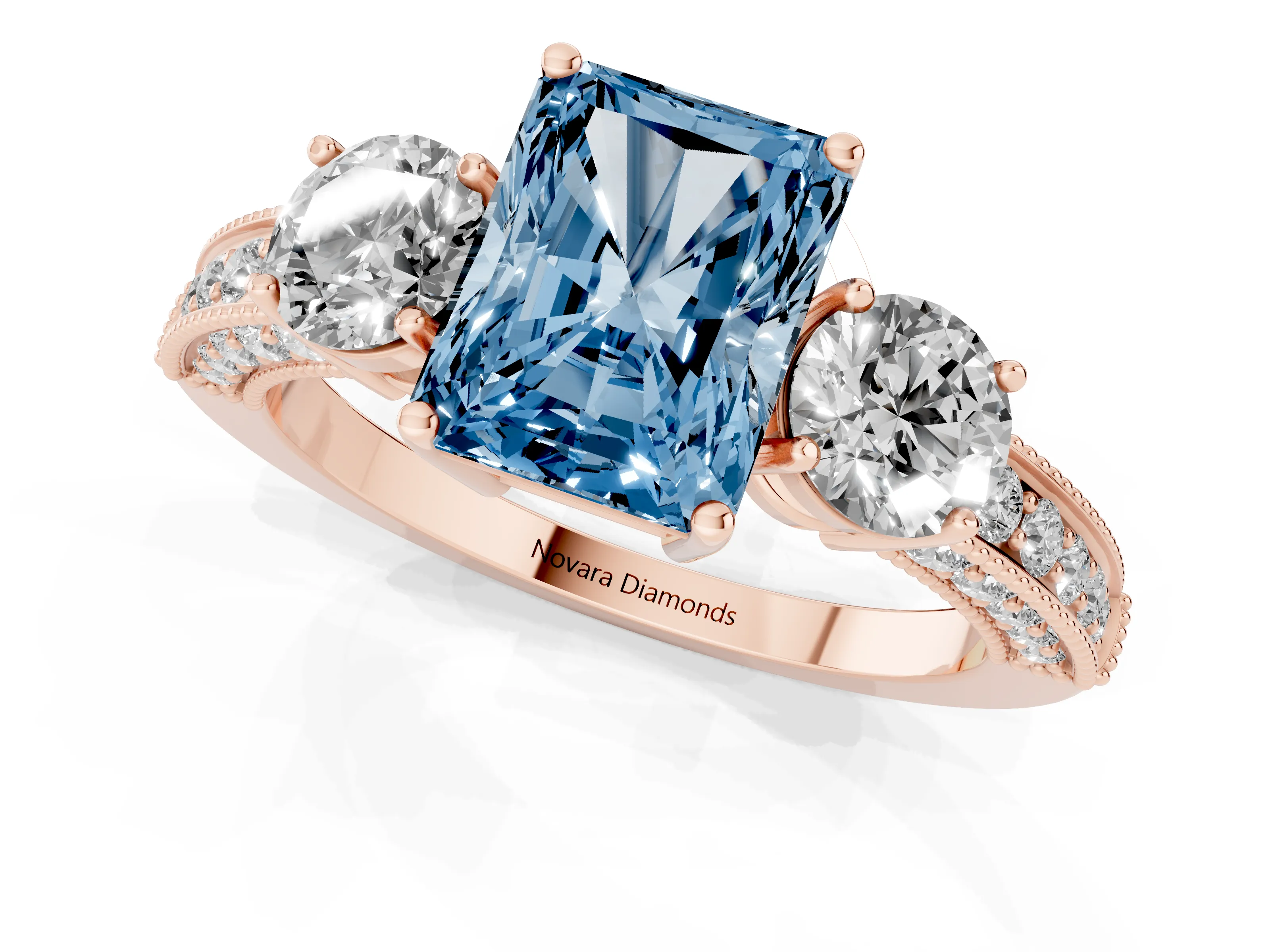 Fancy Blue Radiant Cut Diamond Three-Stone Ring Set in Rose gold with Round Side Stones and Pavé Band