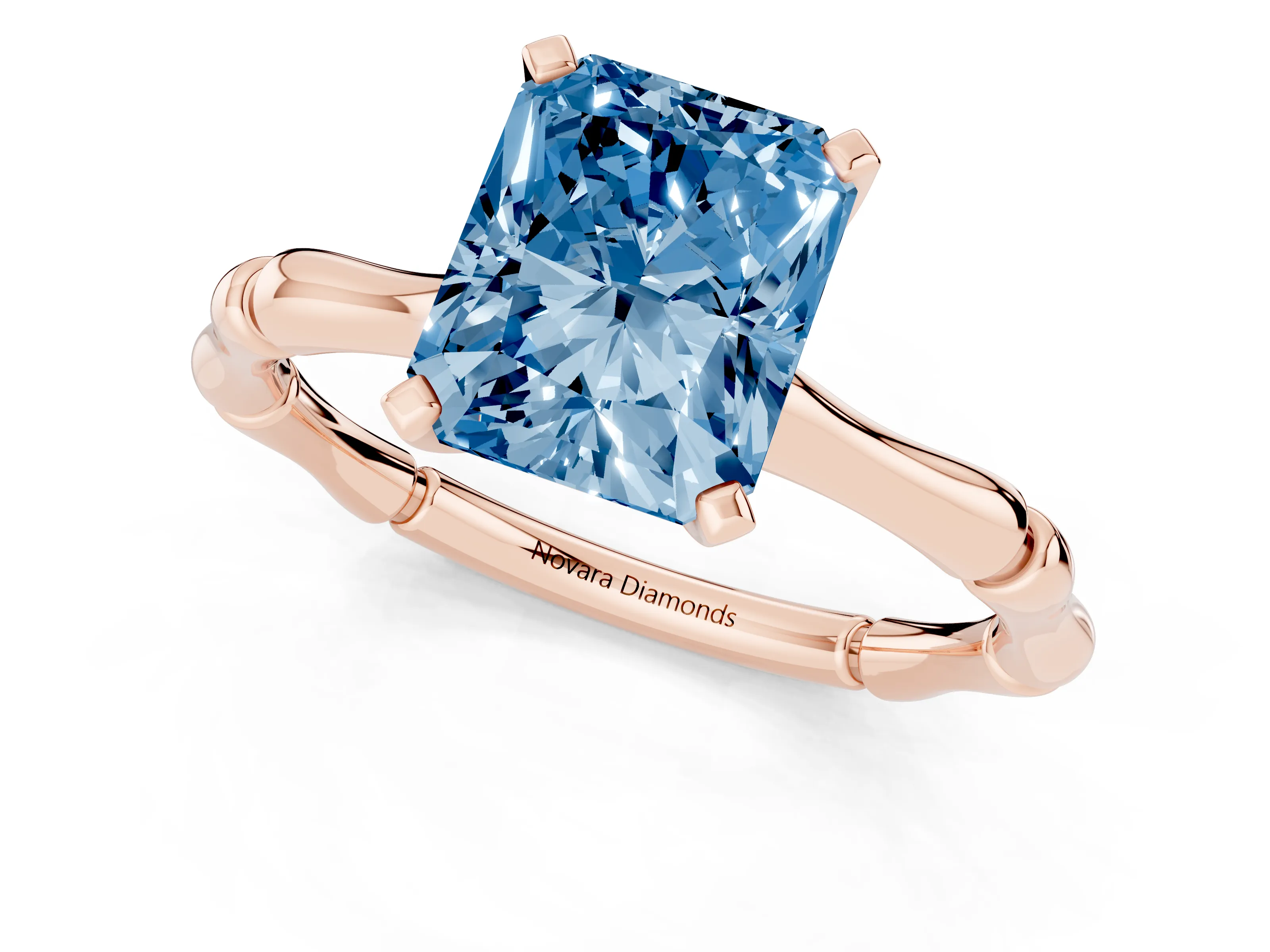 Fancy Blue Radiant Cut Diamond Solitaire Ring Set in Rose gold with Bamboo Band and Prong Setting