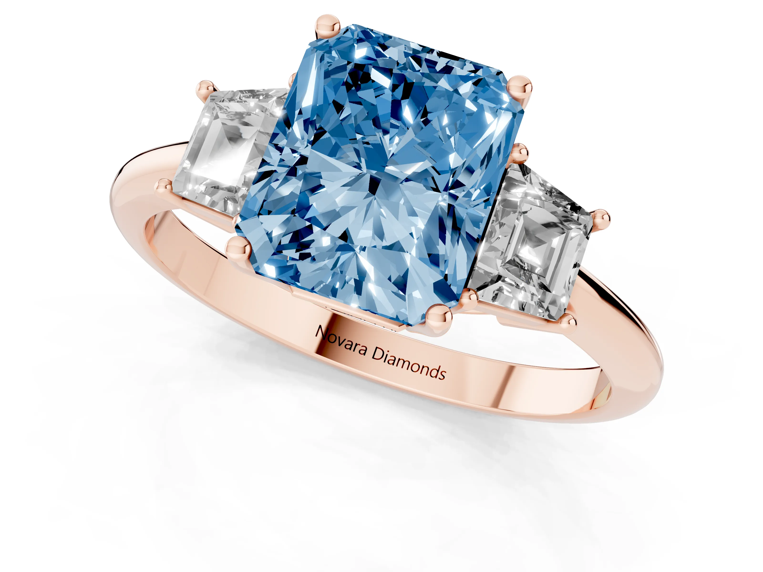 Fancy Blue Radiant Cut Diamond Three-Stone Ring Set in Rose gold with Trapezoid Side Stones and Prong Setting