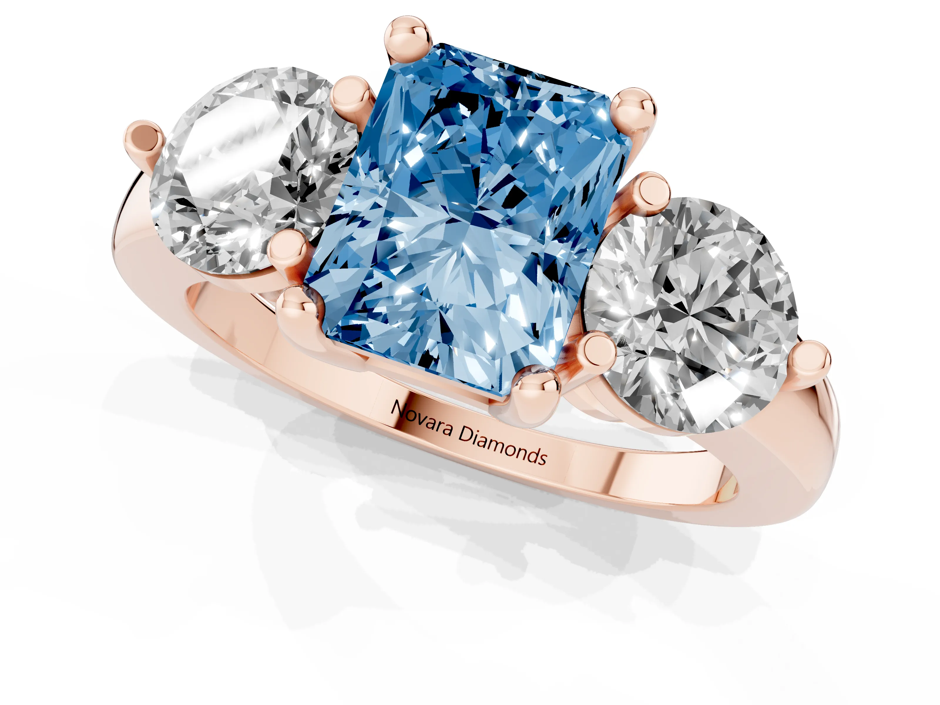 Fancy Blue Radiant Cut Diamond Three-Stone Ring Set in Rose gold with Prong Setting and Classic Band