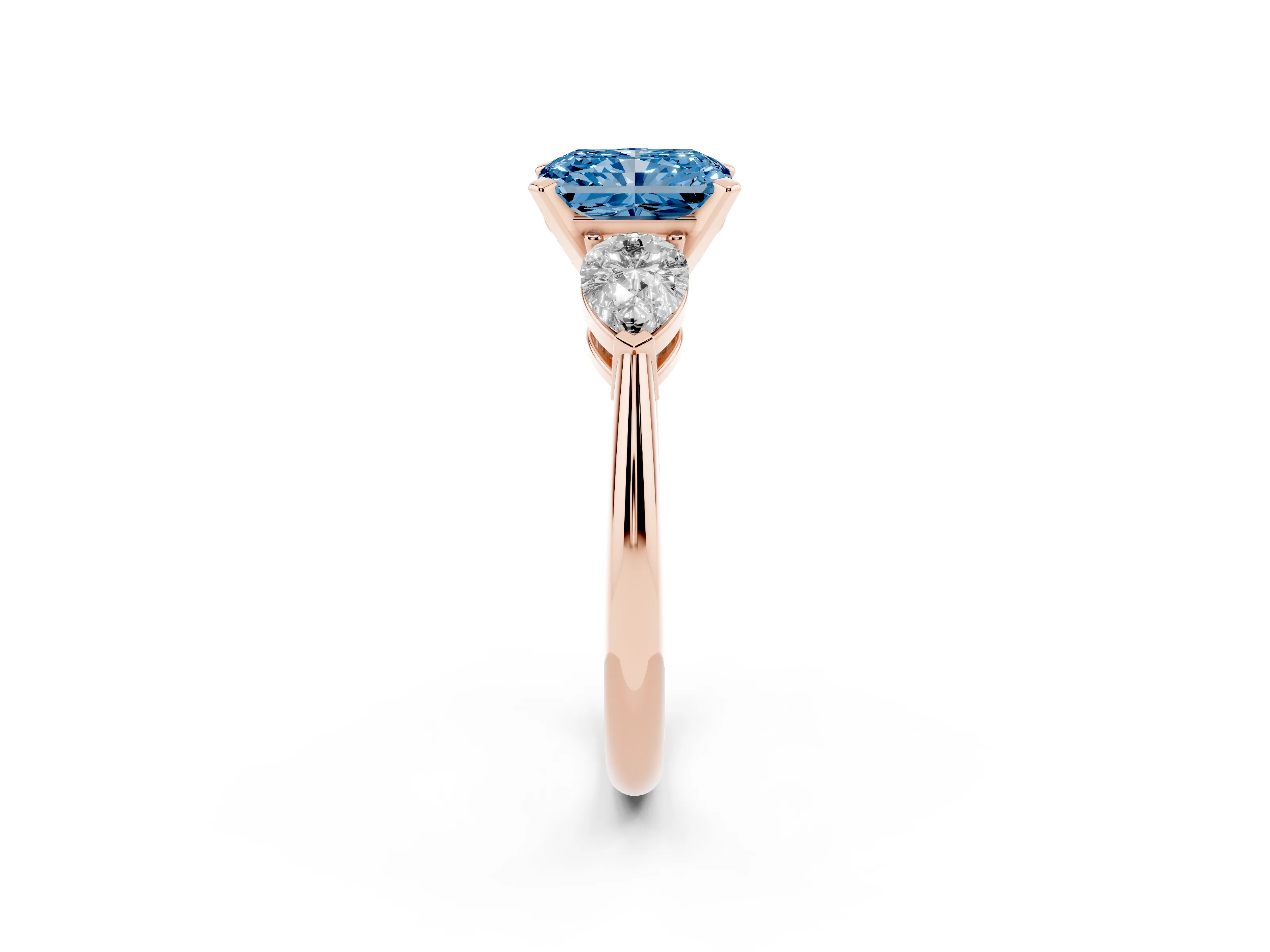 Fancy Blue Three-Stone Radiant Cut Diamond Ring Set in Rose gold with Pear Side Stones and Prong Setting