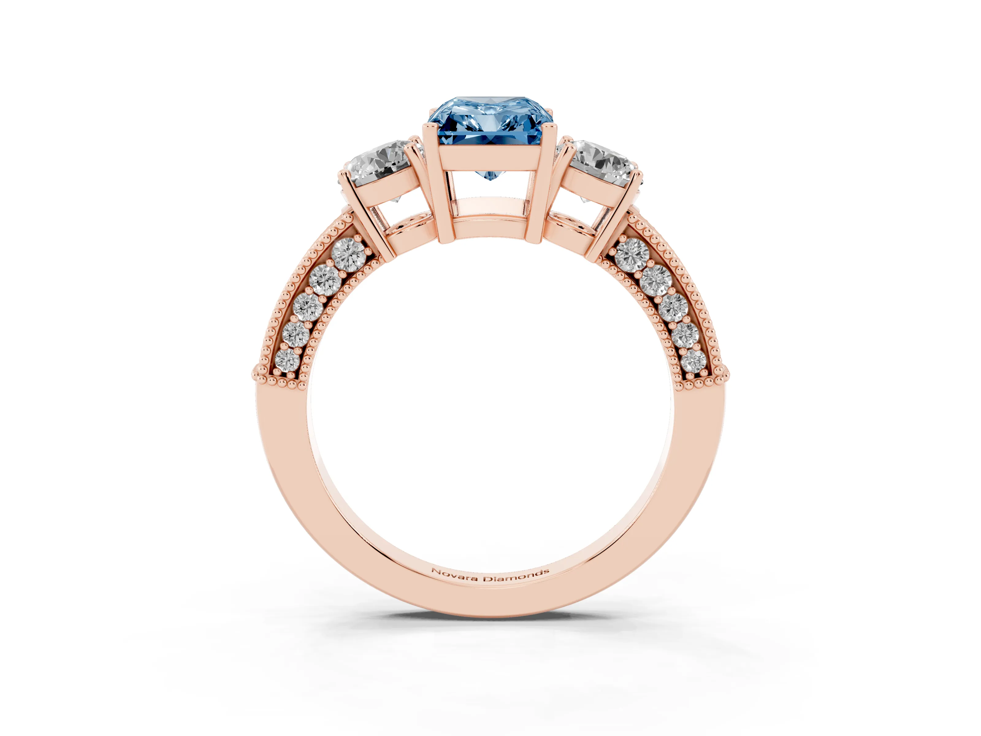 Fancy Blue Radiant Cut Diamond Three-Stone Ring Set in Rose gold with Round Side Stones and Pavé Band