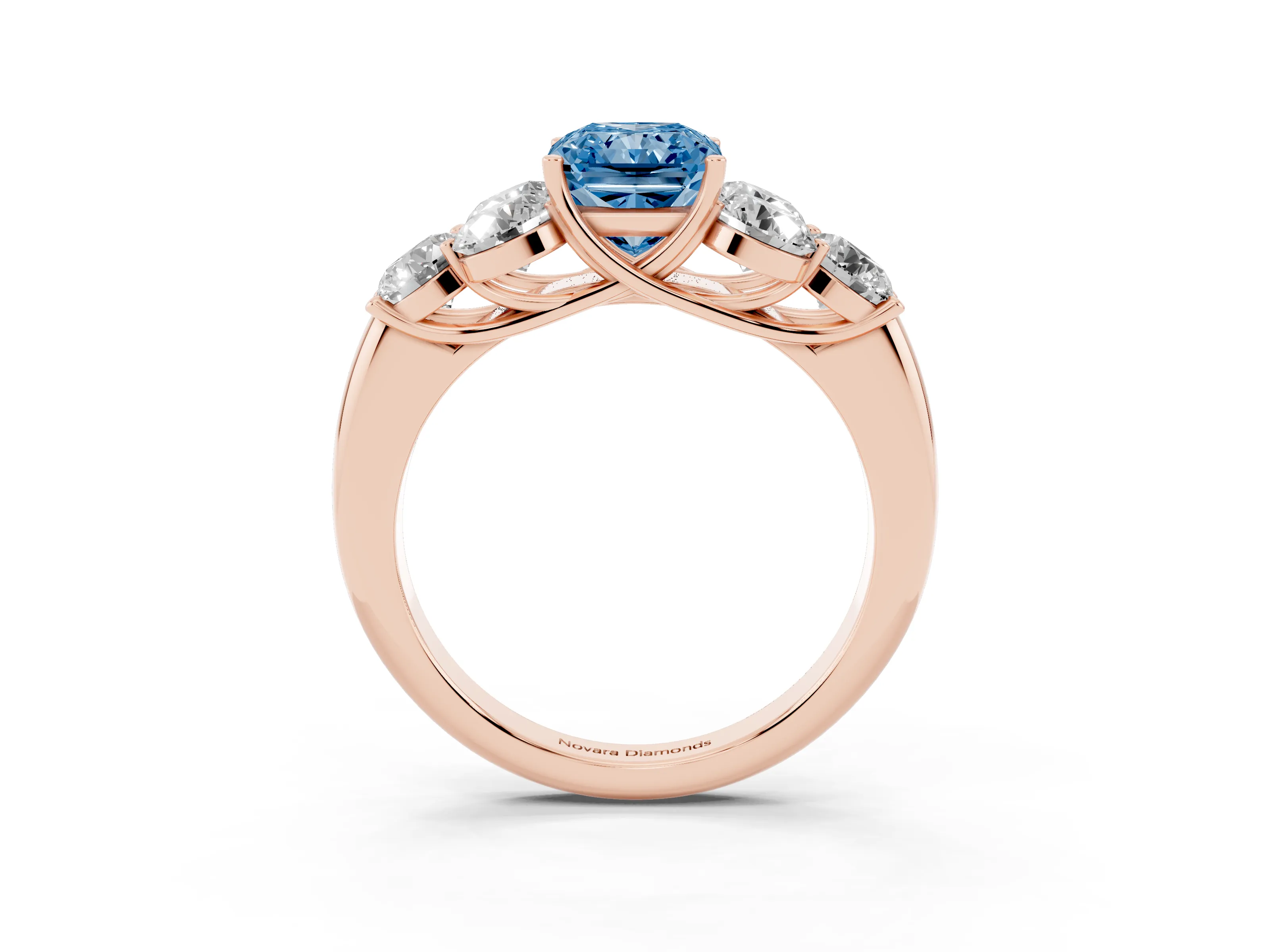 Fancy Blue Radiant Cut Diamond Cluster Ring Set in Rose gold with Round Accent Stones and Prong Setting on a Plain Band