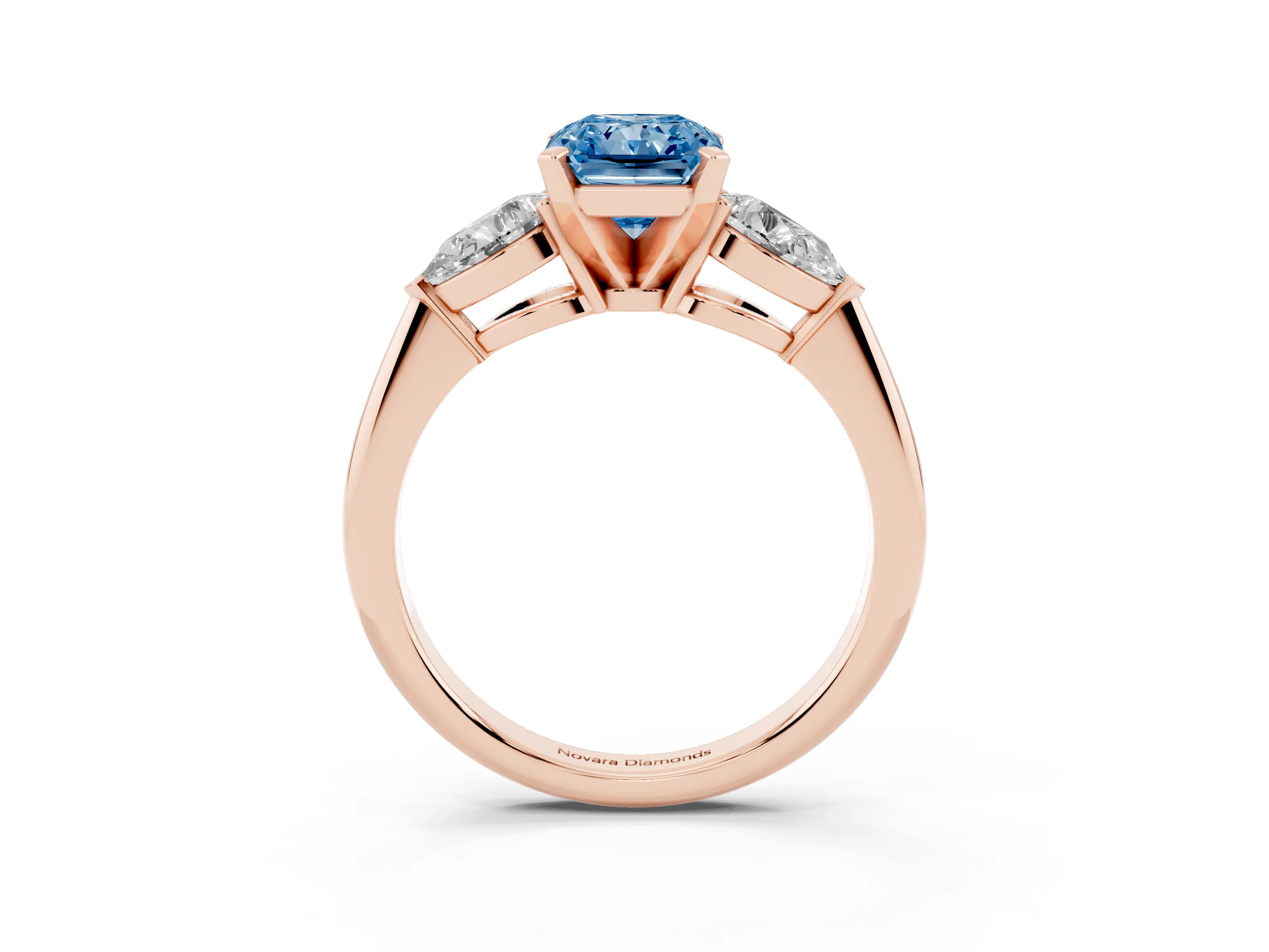 Fancy Blue Three-Stone Radiant Cut Diamond Ring Set in Rose gold with Pear Side Stones and Prong Setting