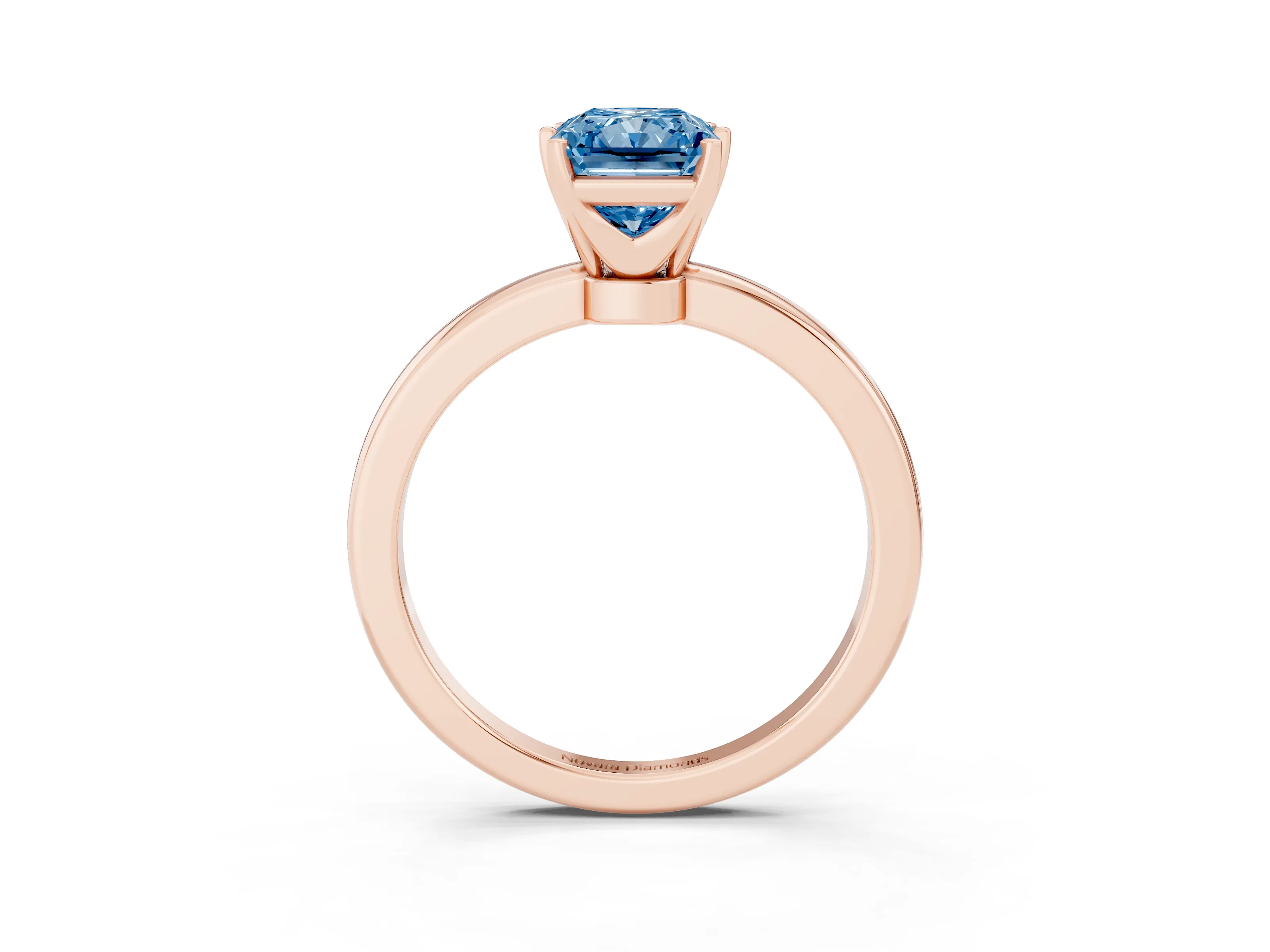 Fancy Blue Radiant Cut Diamond Solitaire Ring Set in Rose gold with Raised Prong Setting on a Classic Band