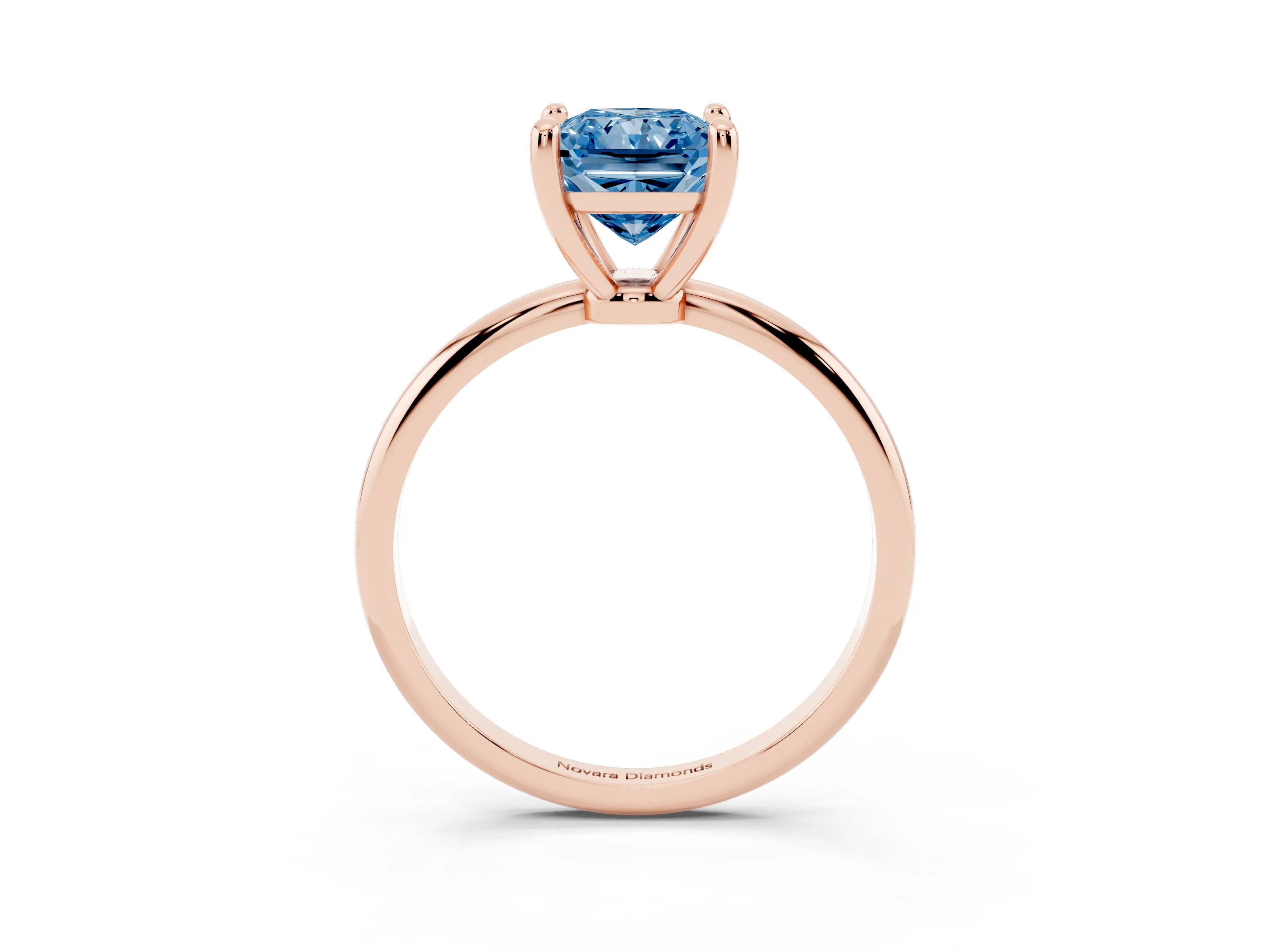 Fancy Blue Radiant Cut Diamond Solitaire Ring Set in Rose gold with Secure Prong Setting on a Classic Band