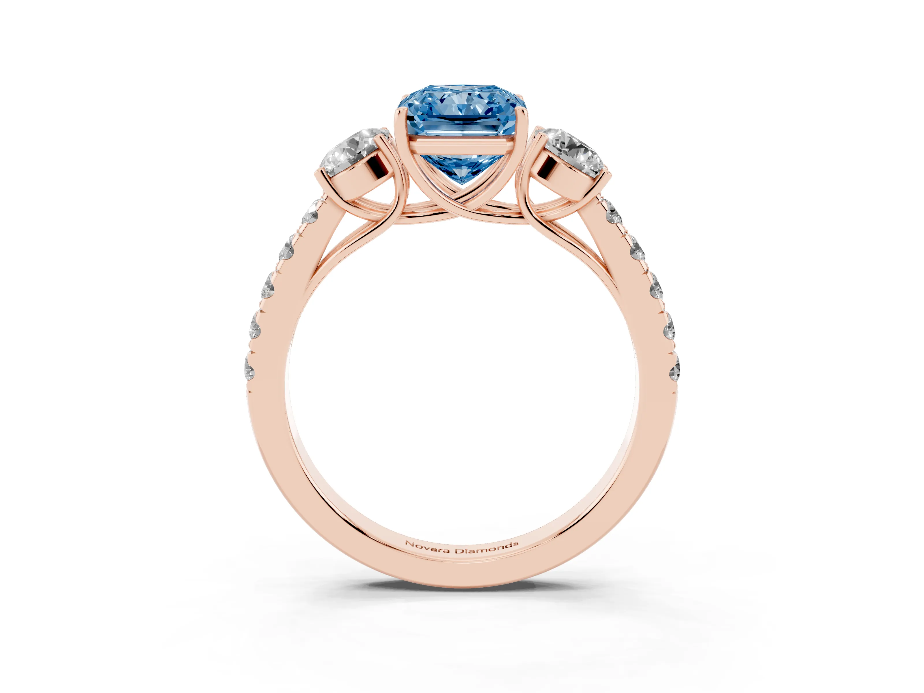 Fancy Blue Radiant Cut Diamond Three-Stone Ring Set in Rose gold with Round Side Stones and Delicate Pavé Band