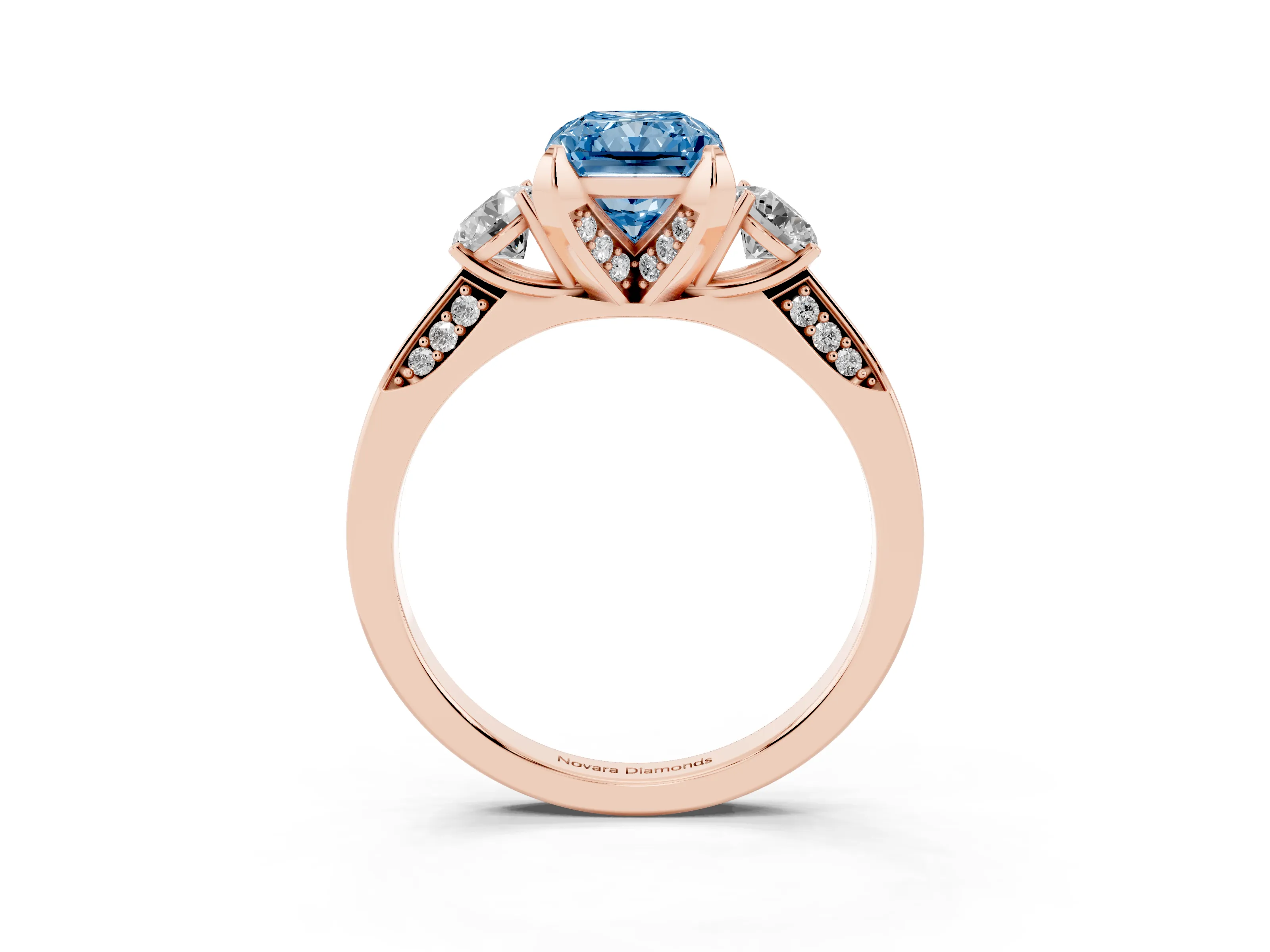 Fancy Blue Radiant Cut Diamond Three-Stone Ring Set in Rose gold with Pavé Band and Smaller Side Stones