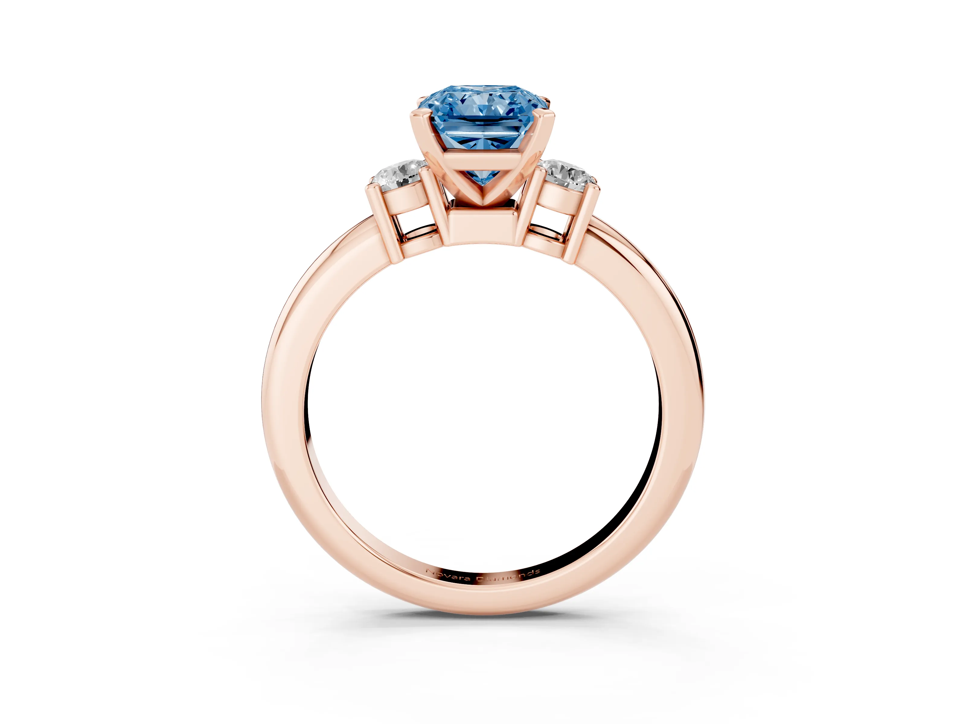 Fancy Blue Three-Stone Radiant Cut Diamond Ring Set in Rose gold with Prong Setting and Plain Band