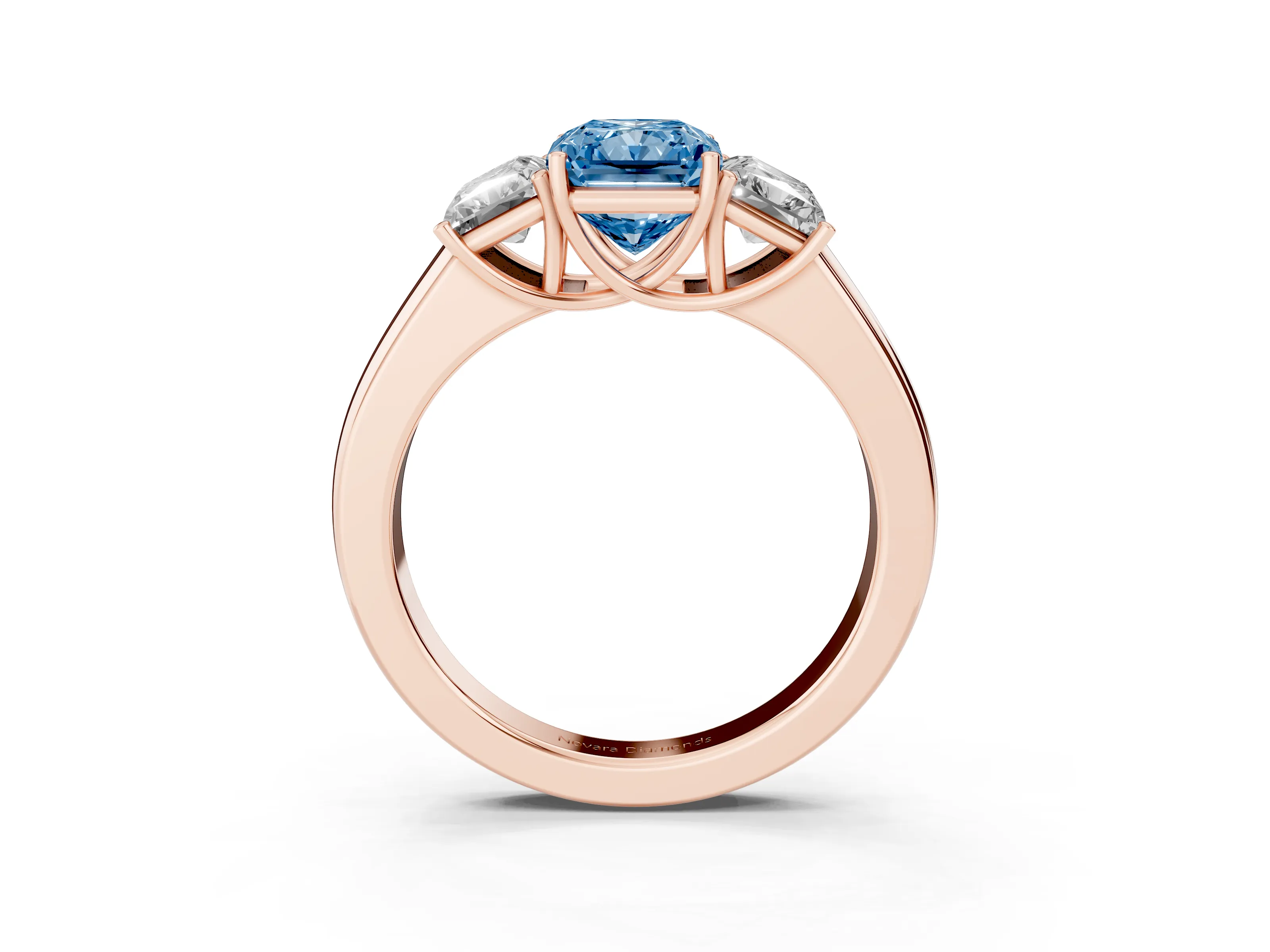 Fancy Blue Three-Stone Radiant Cut Diamond Ring Set in Rose gold with Matching Prong Settings and Plain Band
