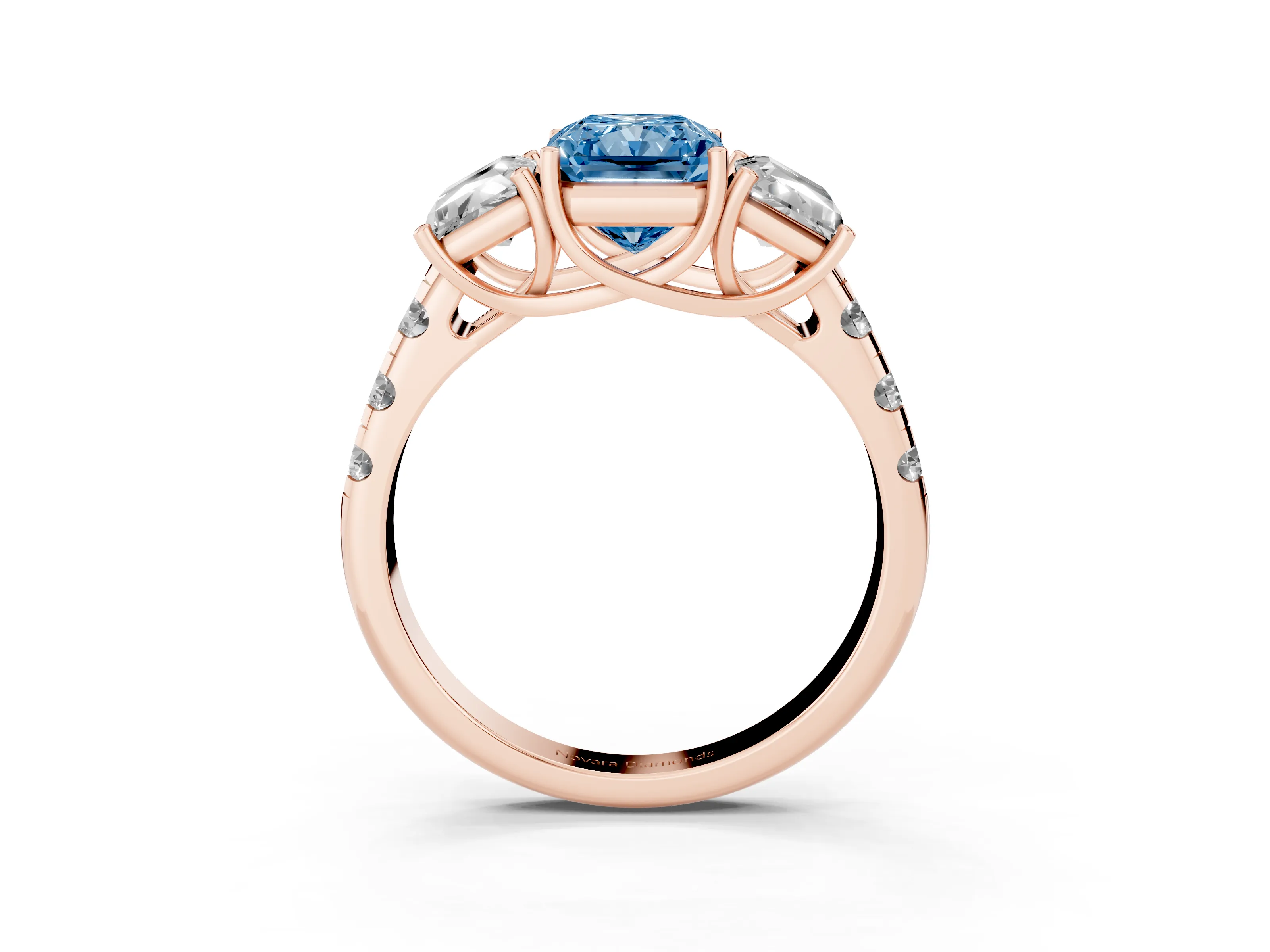Fancy Blue Radiant Cut Diamond Three-Stone Ring Set in Rose gold with Pavé Band