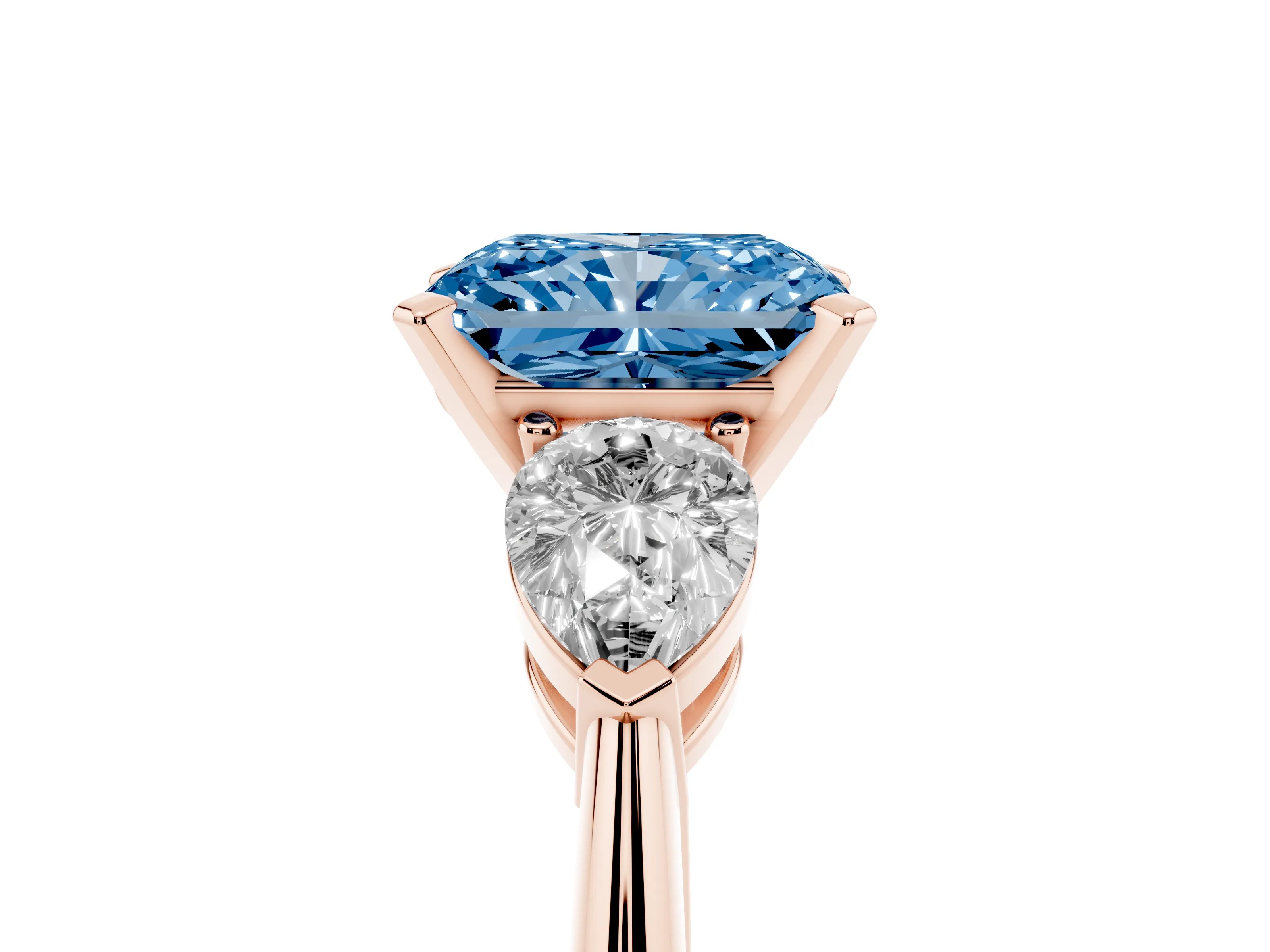 Fancy Blue Three-Stone Radiant Cut Diamond Ring Set in Rose gold with Pear Side Stones and Prong Setting