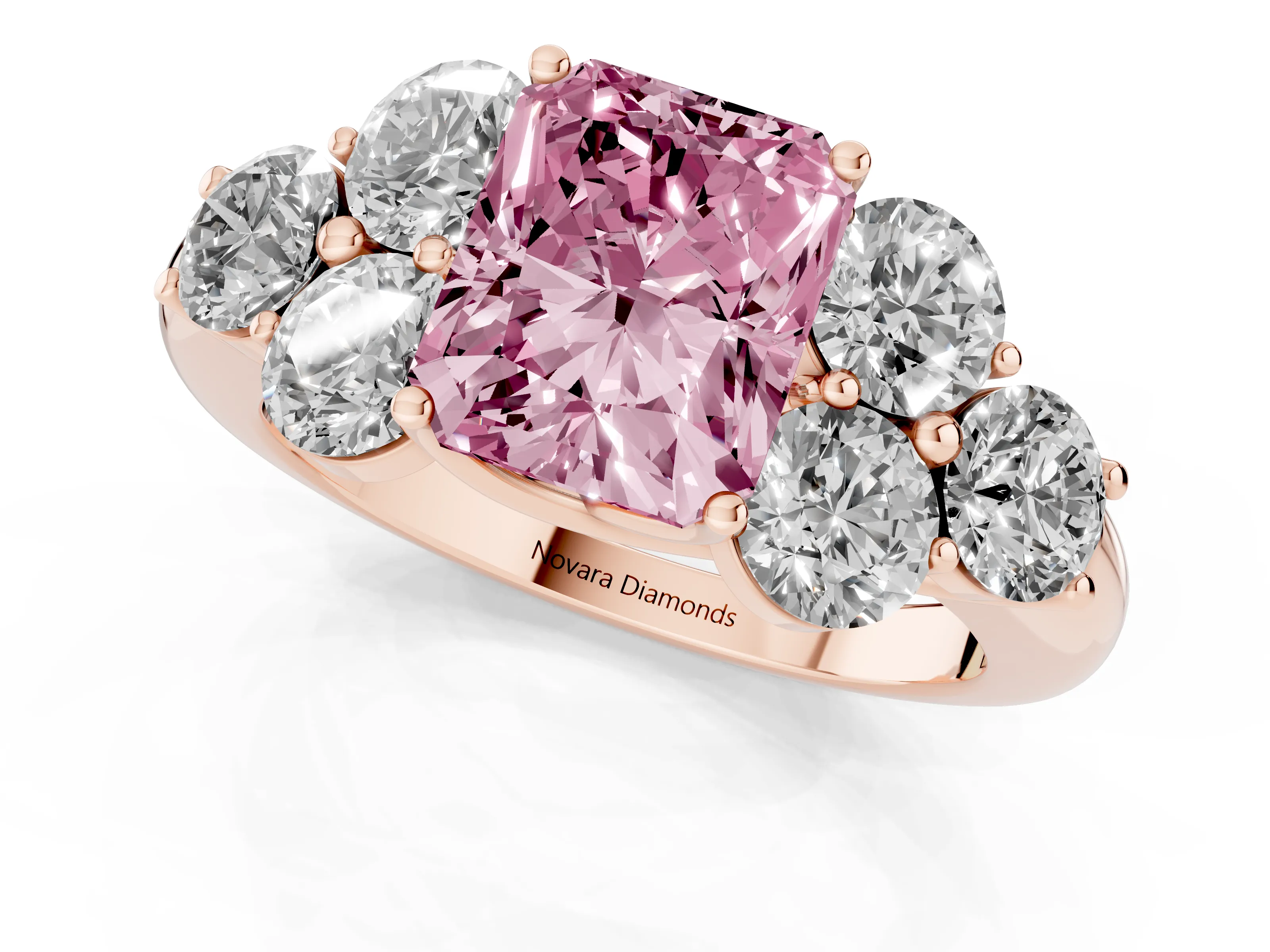 Fancy Pink Radiant Cut Diamond Cluster Ring Set in Rose gold with Round Accent Stones and Prong Setting on a Plain Band