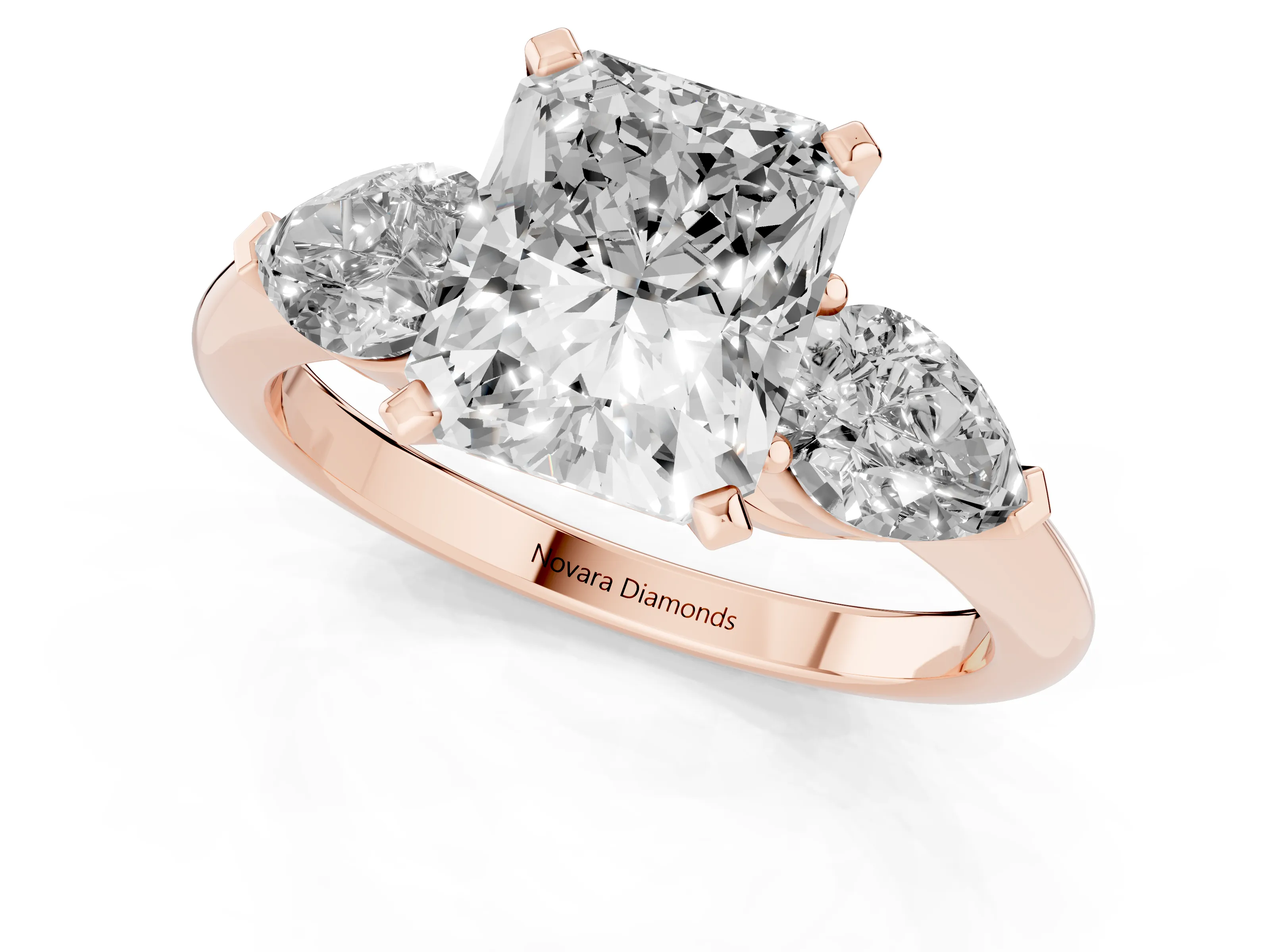 Three-Stone Radiant Cut Diamond Ring Set in Rose gold with Pear Side Stones and Prong Setting