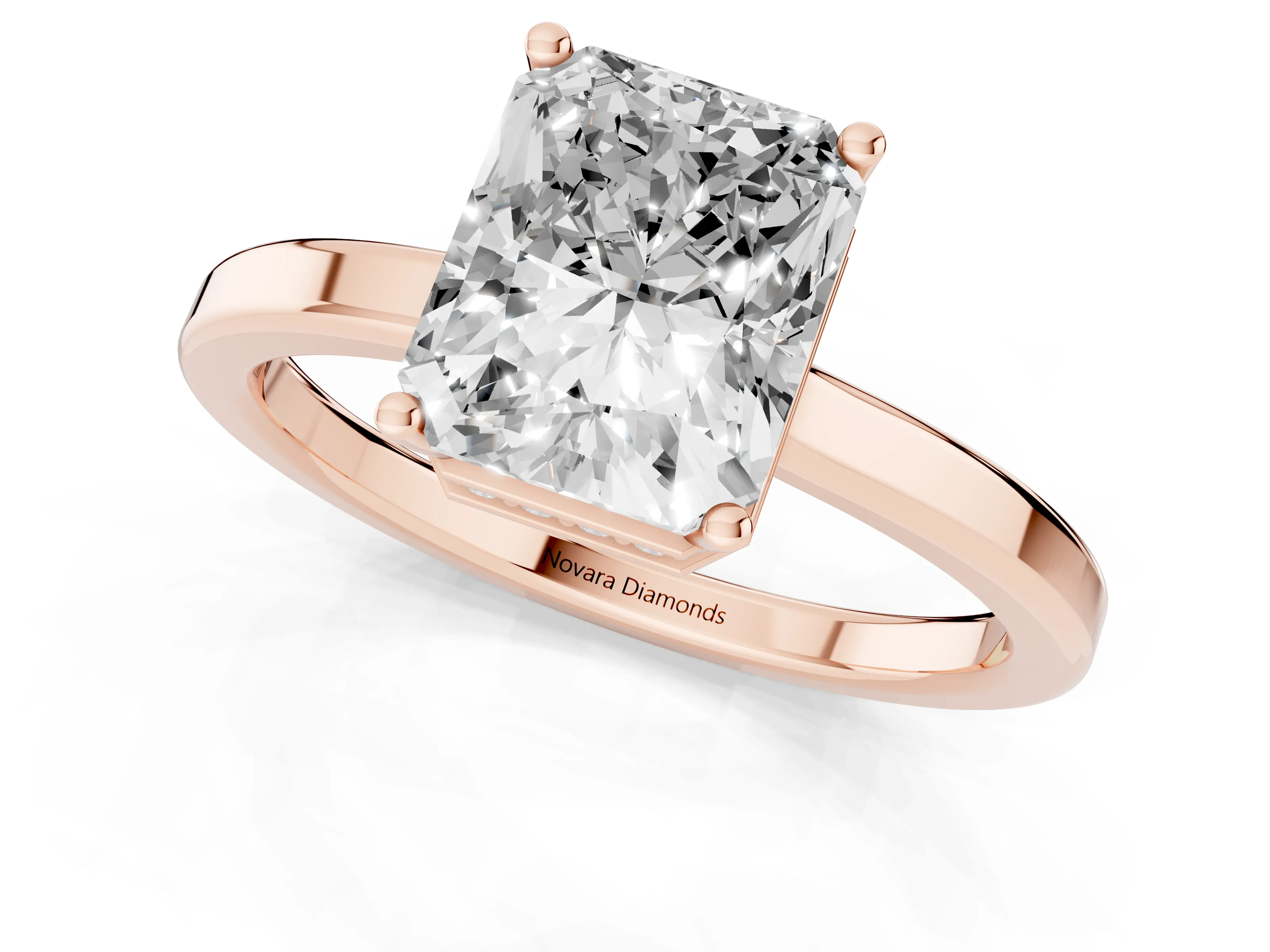 Radiant Cut Diamond Solitaire Engagement Ring Set in Rose gold with Prong Setting on a Plain Band