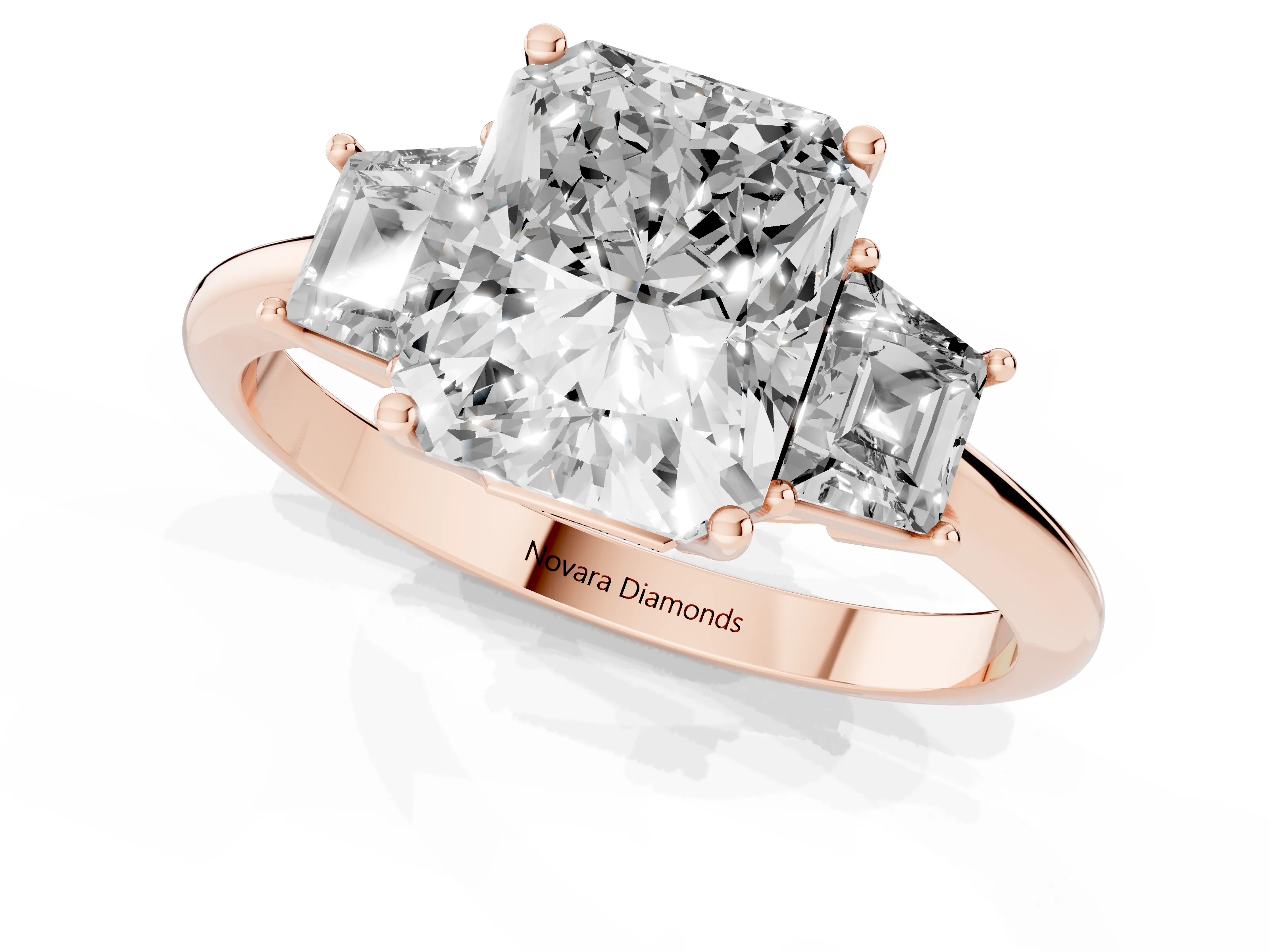 Radiant Cut Diamond Three-Stone Ring Set in Rose gold with Trapezoid Side Stones and Prong Setting