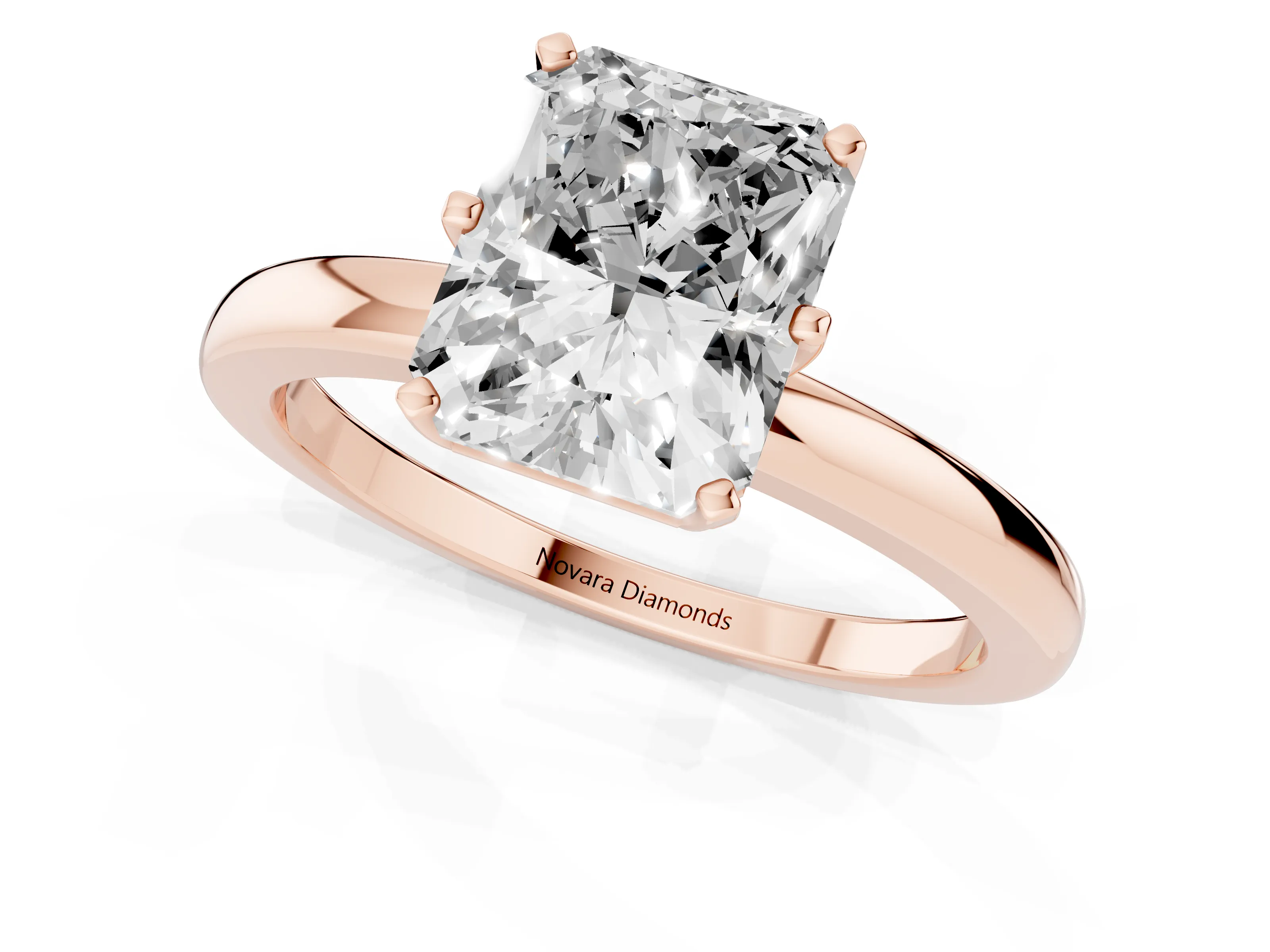 Radiant Cut Diamond Solitaire Ring Set in Rose gold with Raised Prong Setting on a Classic Band