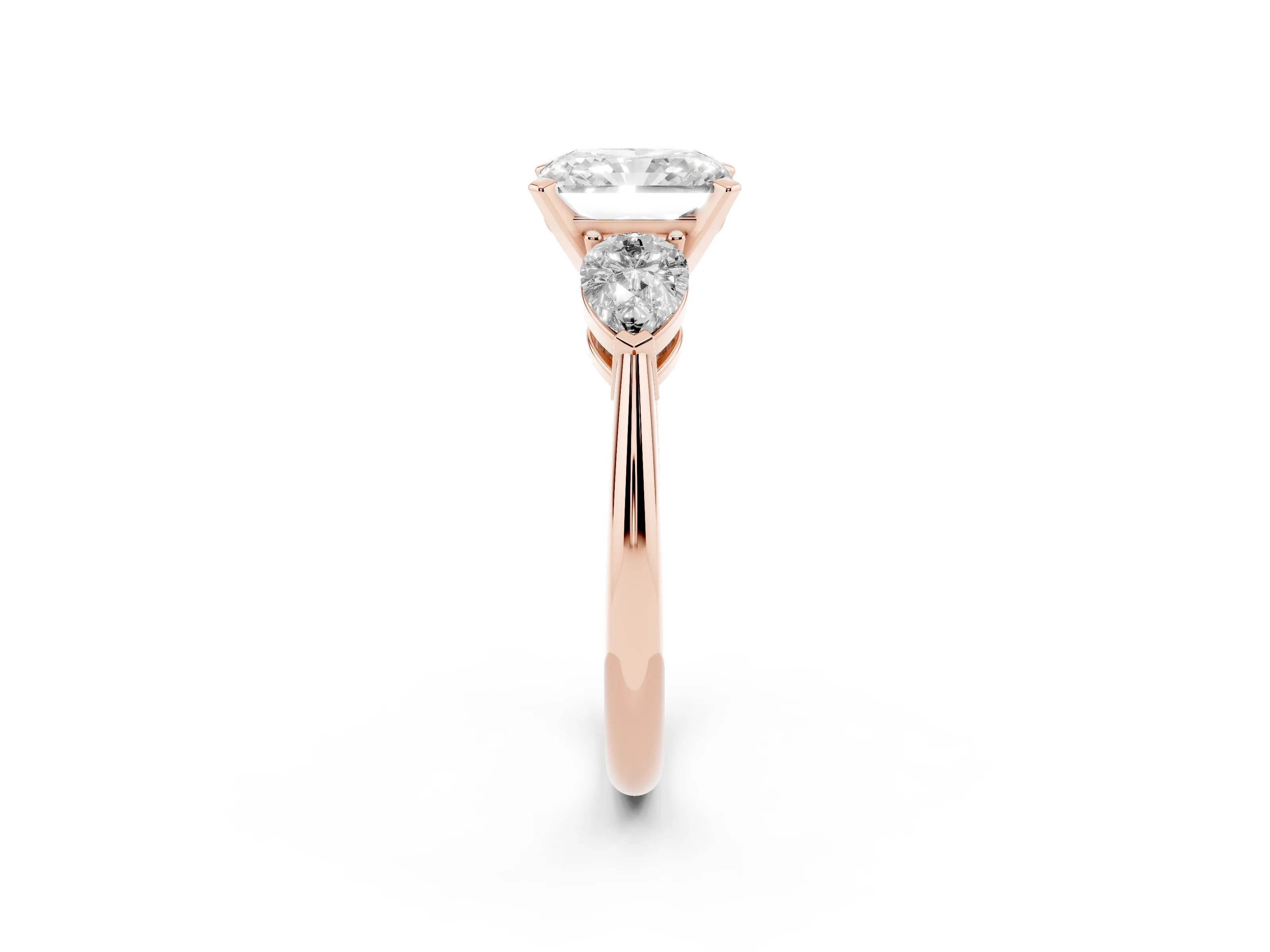 Three-Stone Radiant Cut Diamond Ring Set in Rose gold with Pear Side Stones and Prong Setting