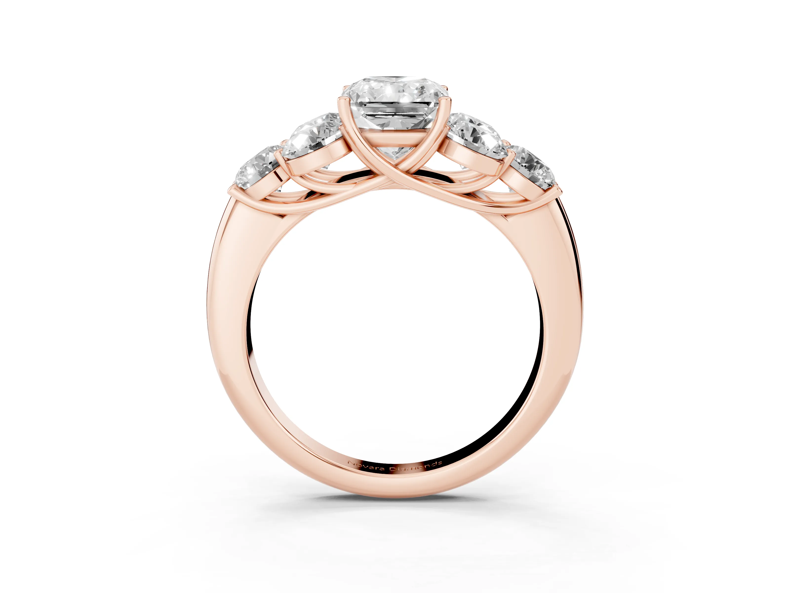 Radiant Cut Diamond Cluster Ring Set in Rose gold with Round Accent Stones and Prong Setting on a Plain Band