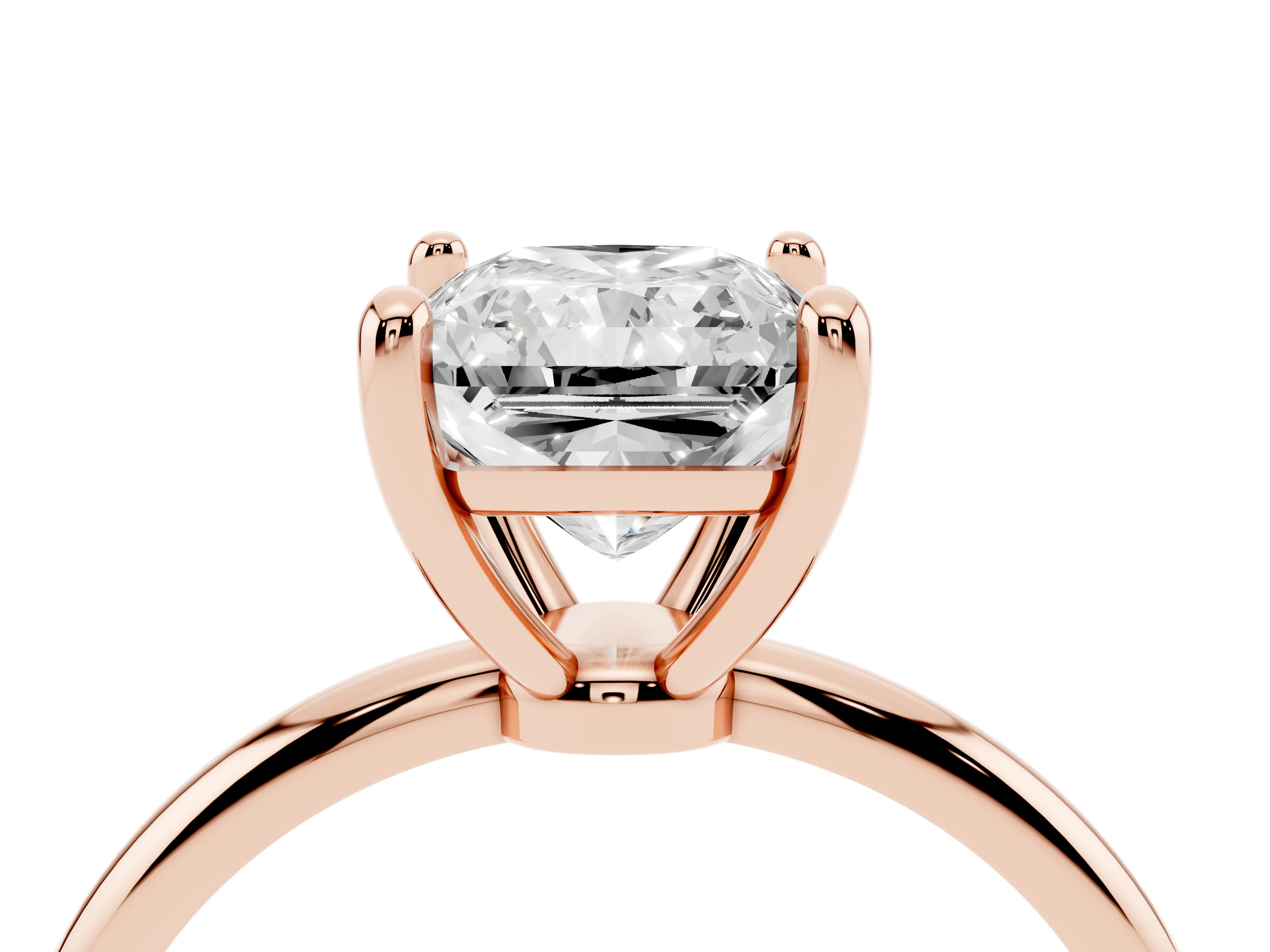 Radiant Cut Diamond Solitaire Ring Set in Rose gold with Secure Prong Setting on a Classic Band