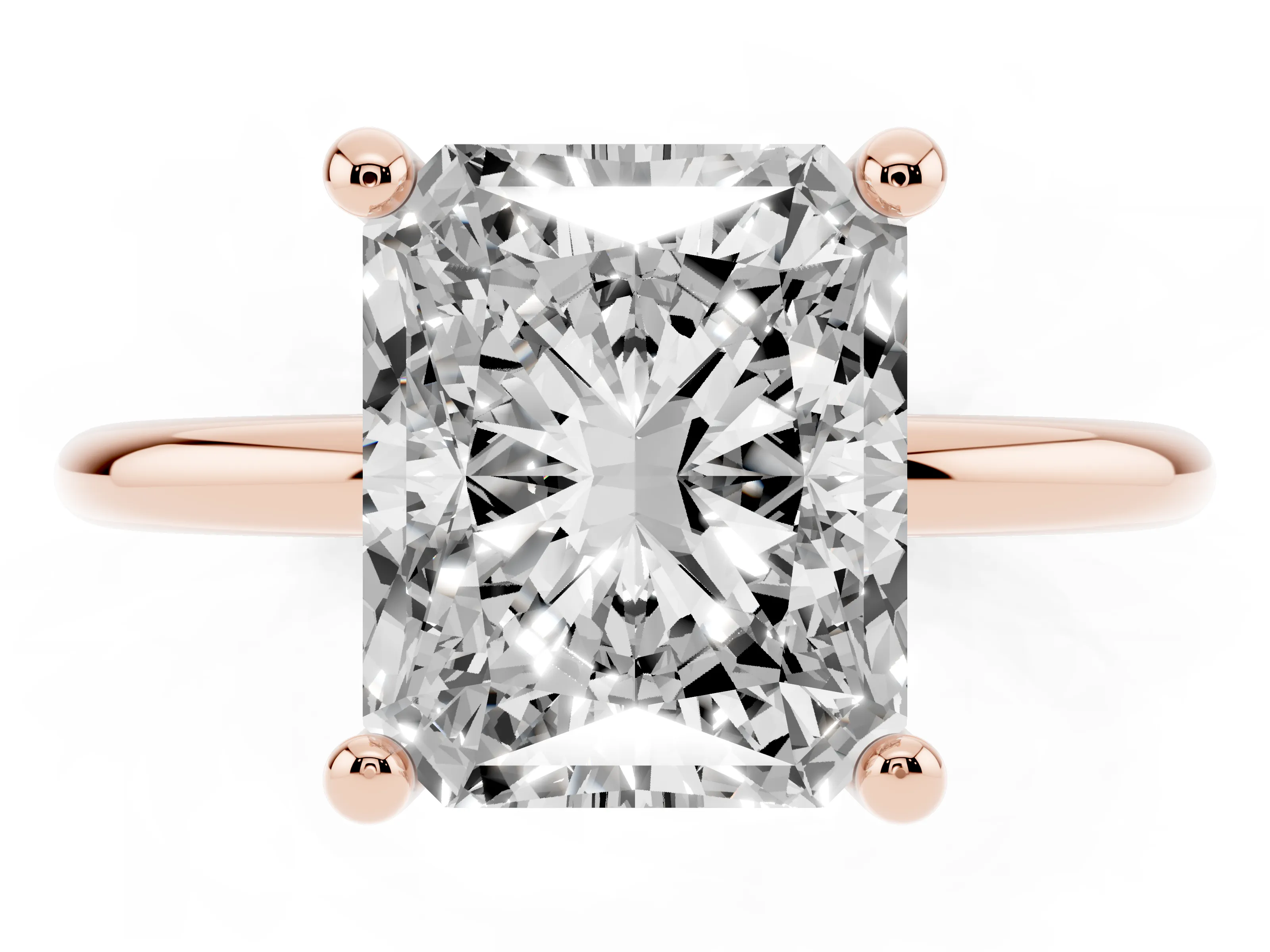 Radiant Cut Diamond Solitaire Ring Set in Rose gold with Secure Prong Setting on a Classic Band