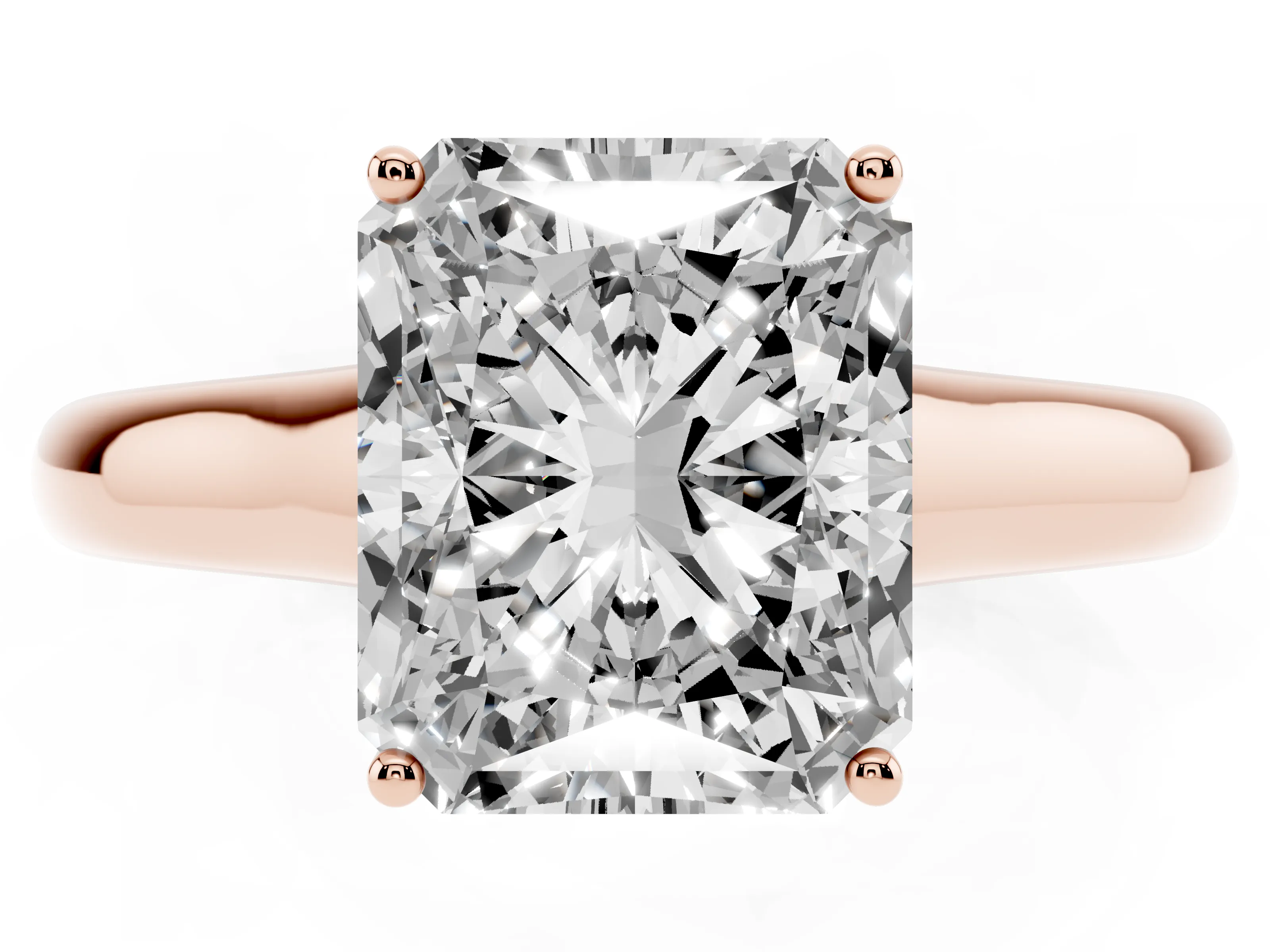 Radiant Cut Diamond Solitaire Engagement Ring Set in Rose gold with Subtly Tapered Band and Prong Setting