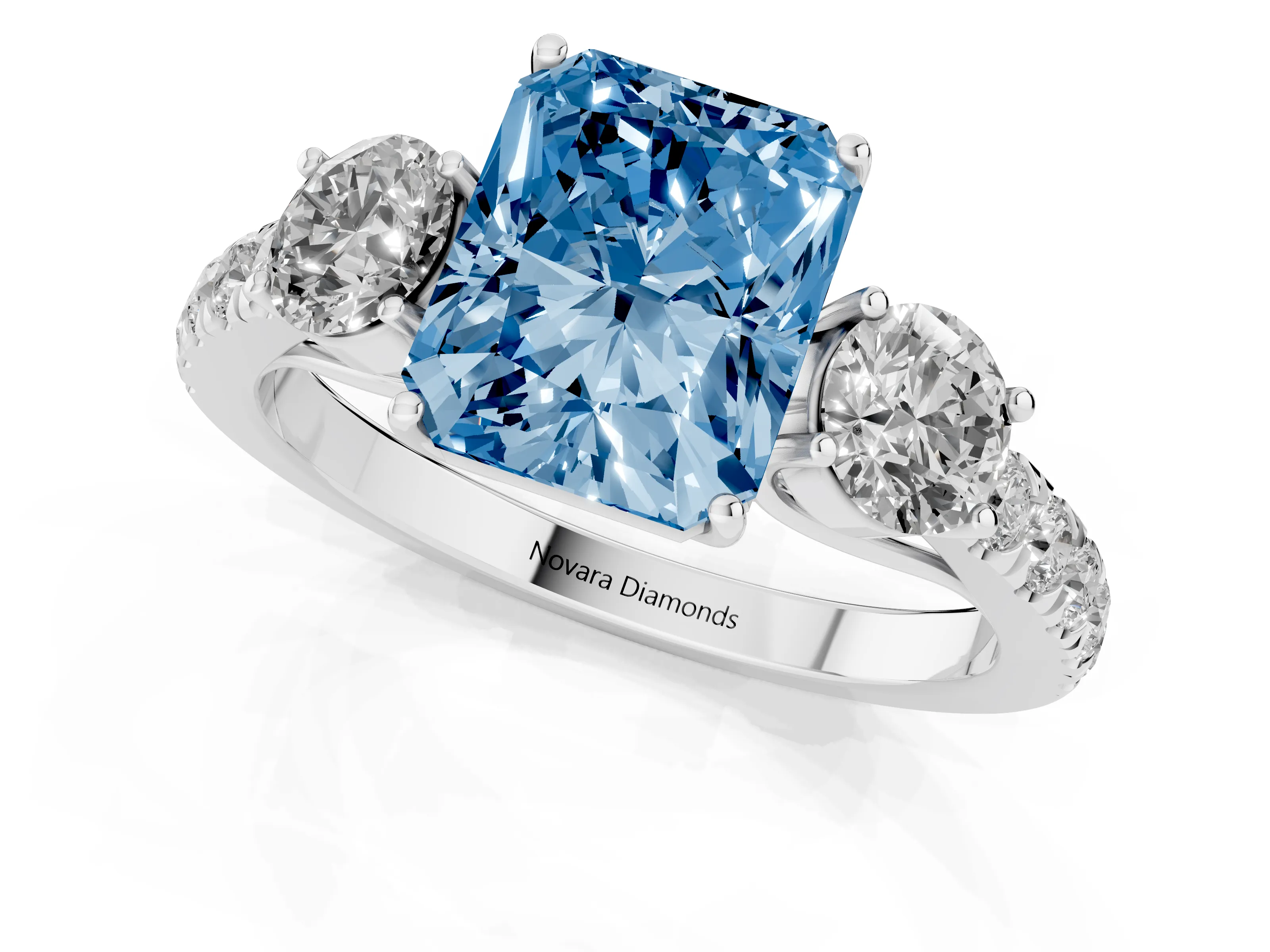 Fancy Blue Radiant Cut Diamond Three-Stone Ring Set in Silver with Round Side Stones and Delicate Pavé Band