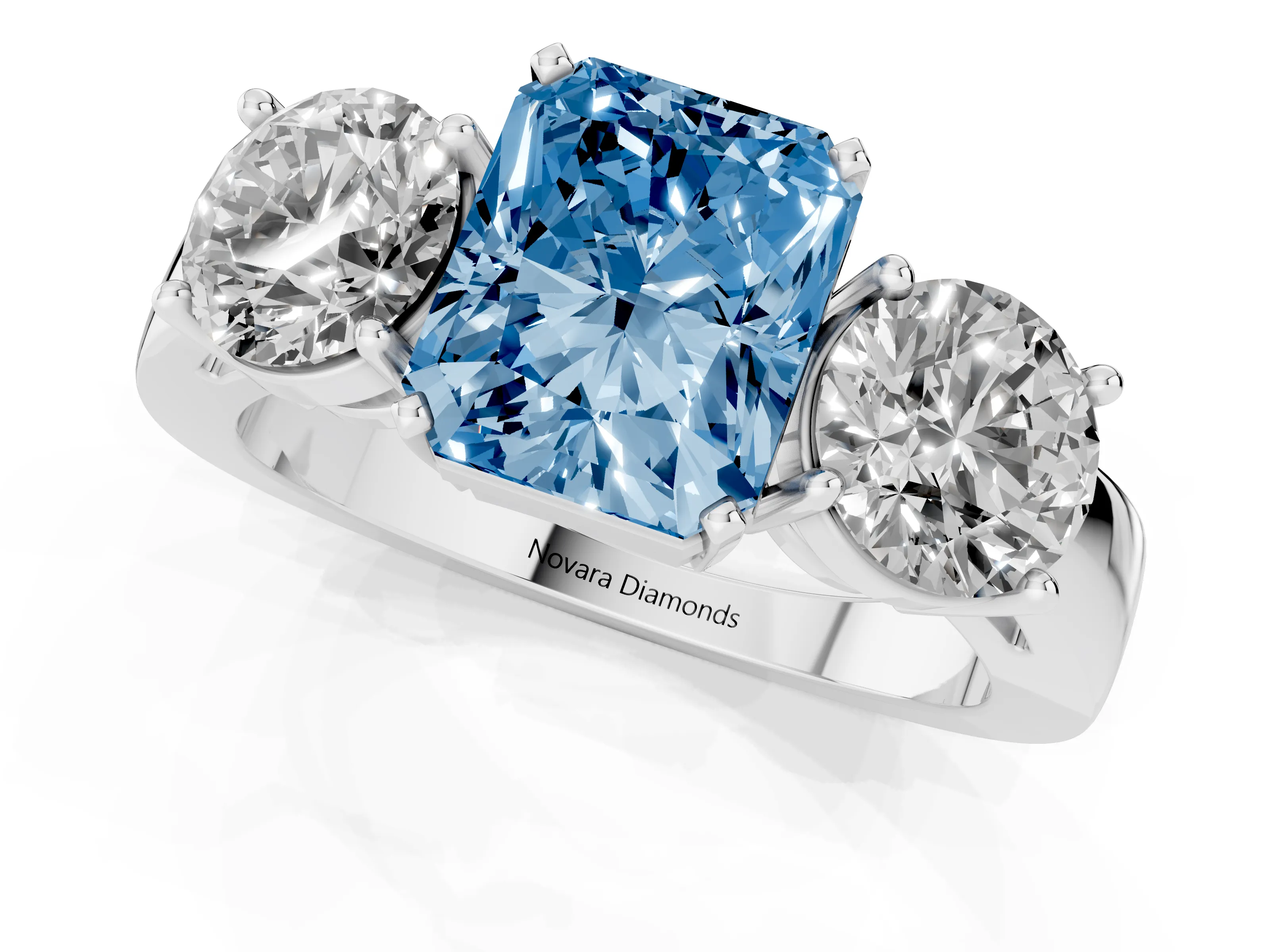 Fancy Blue Radiant Cut Diamond Three-Stone Ring Set in White gold with Round Side Stones and Classic Band