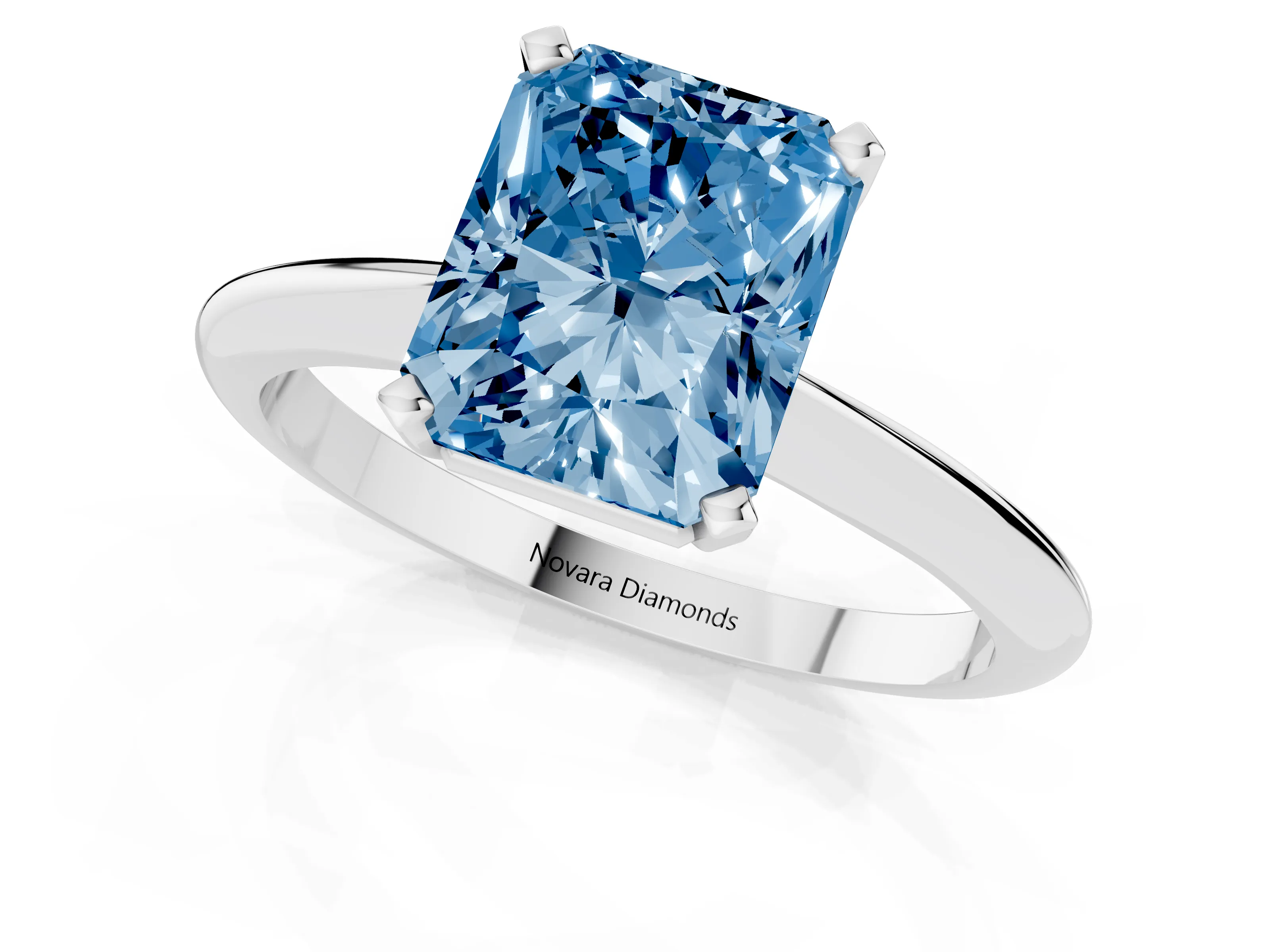 Fancy Blue Radiant Cut Diamond Solitaire Ring Set in Platinum with Prong Setting on a Plain Round Band