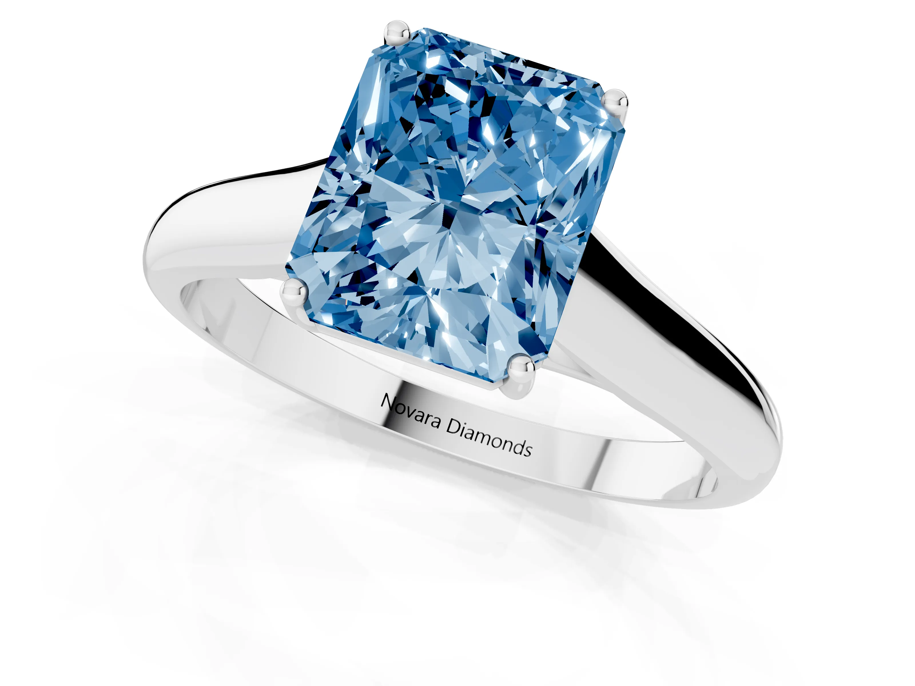 Fancy Blue Radiant Cut Diamond Solitaire Engagement Ring Set in Silver with Subtly Tapered Band and Prong Setting