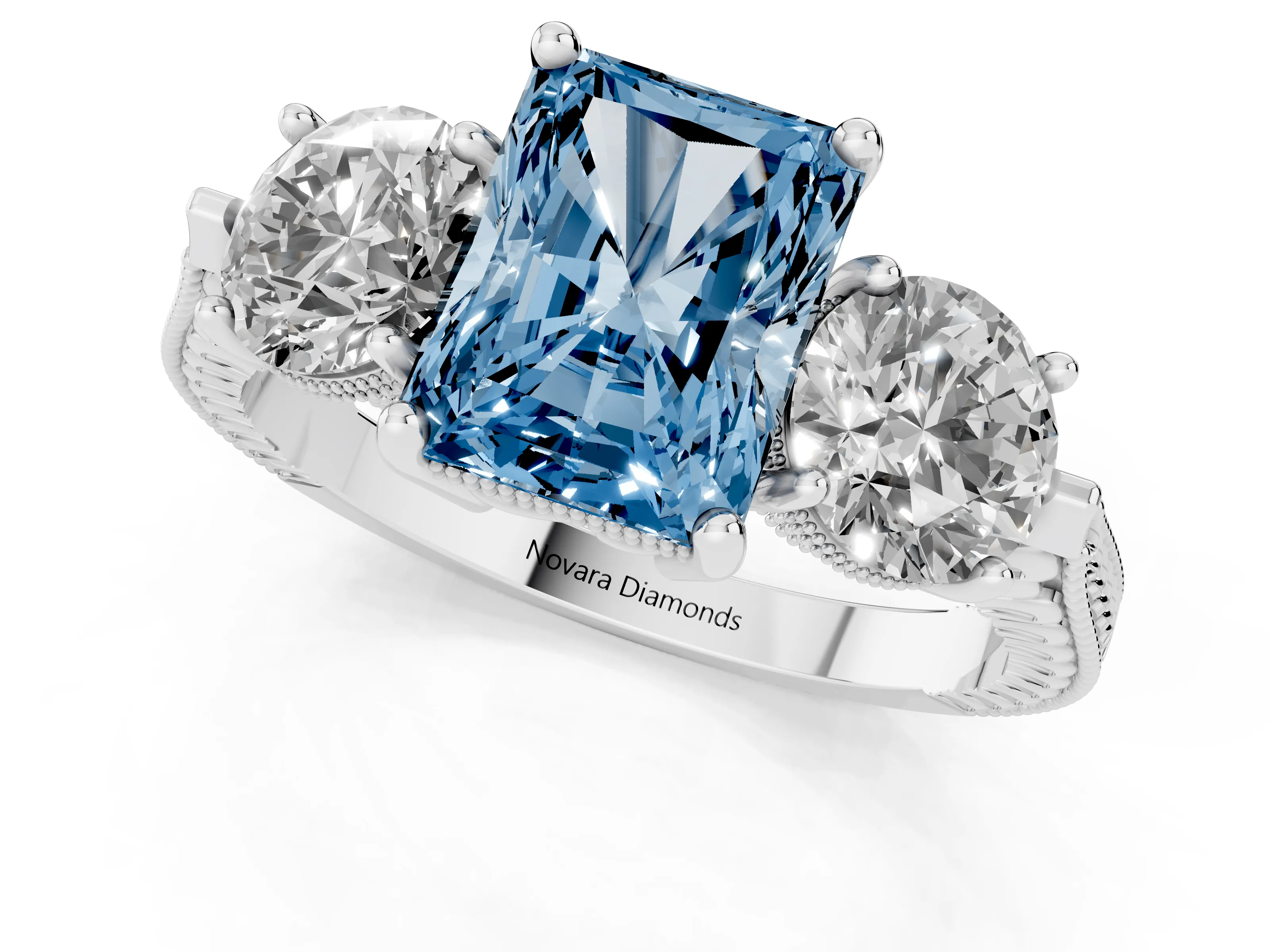 Fancy Blue Radiant Cut Diamond Three-Stone Ring Set in White gold with Milgrain Band