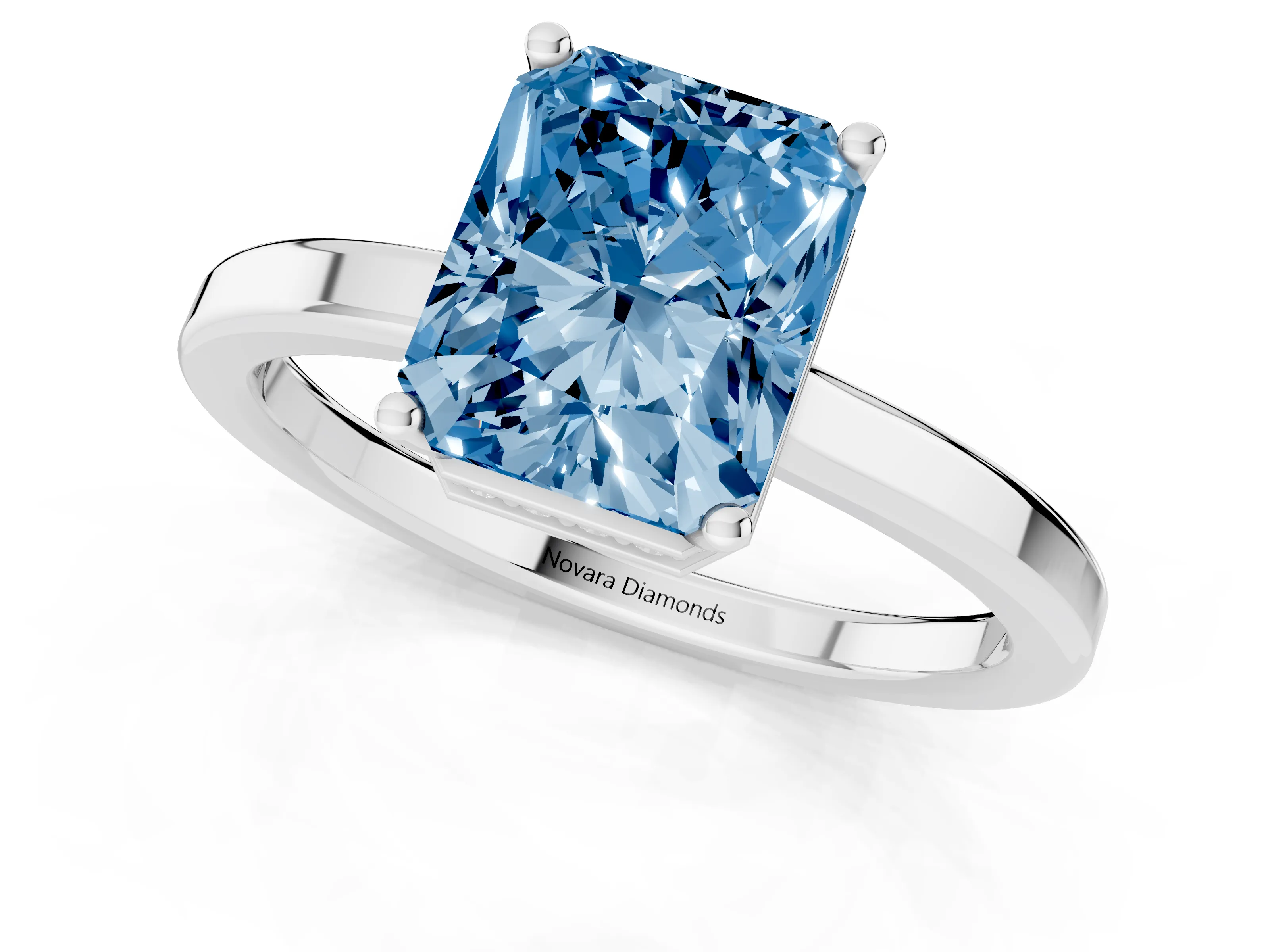 Fancy Blue Radiant Cut Diamond Solitaire Engagement Ring Set in Silver with Prong Setting on a Plain Band