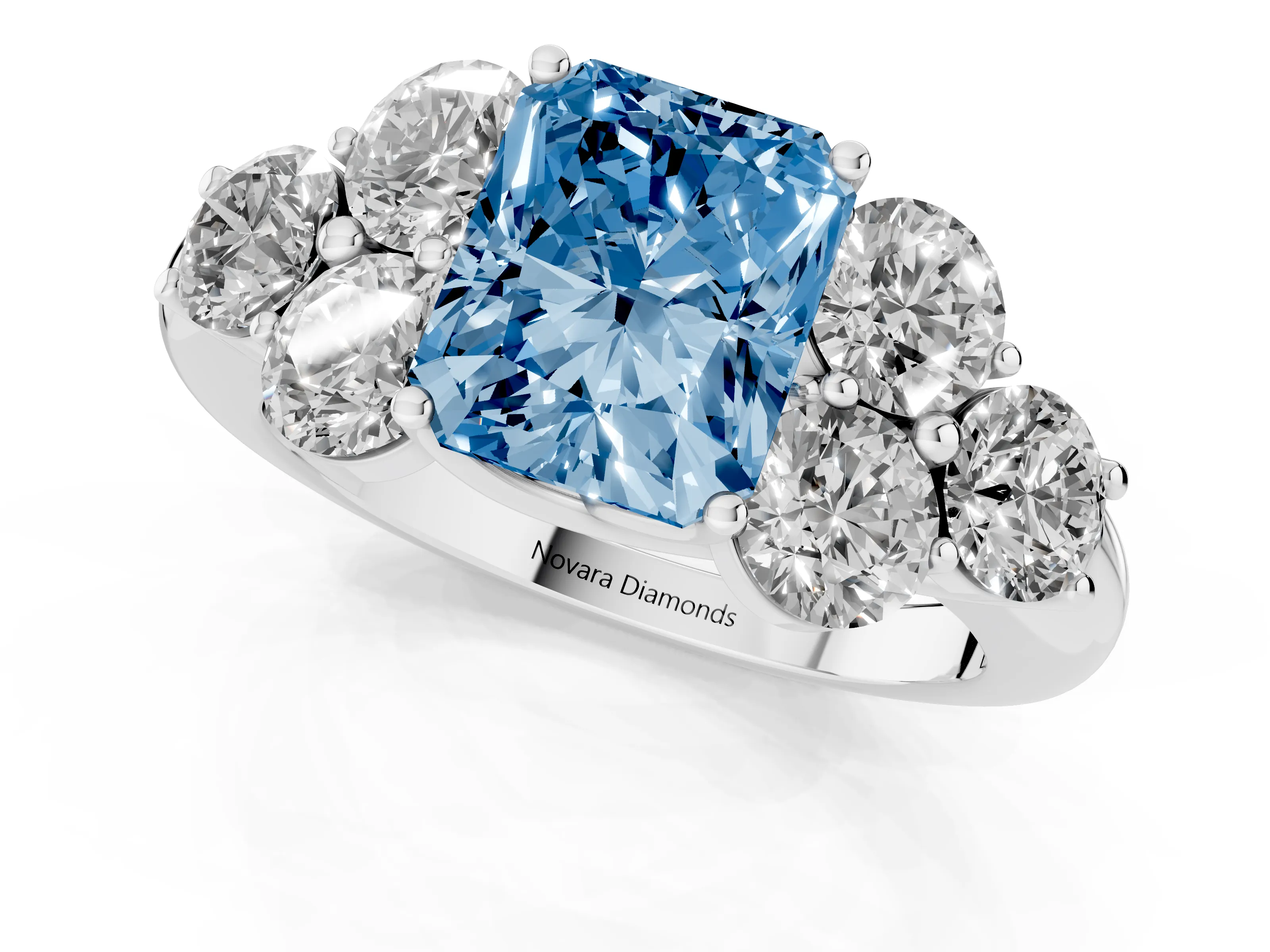Fancy Blue Radiant Cut Diamond Cluster Ring Set in Silver with Round Accent Stones and Prong Setting on a Plain Band