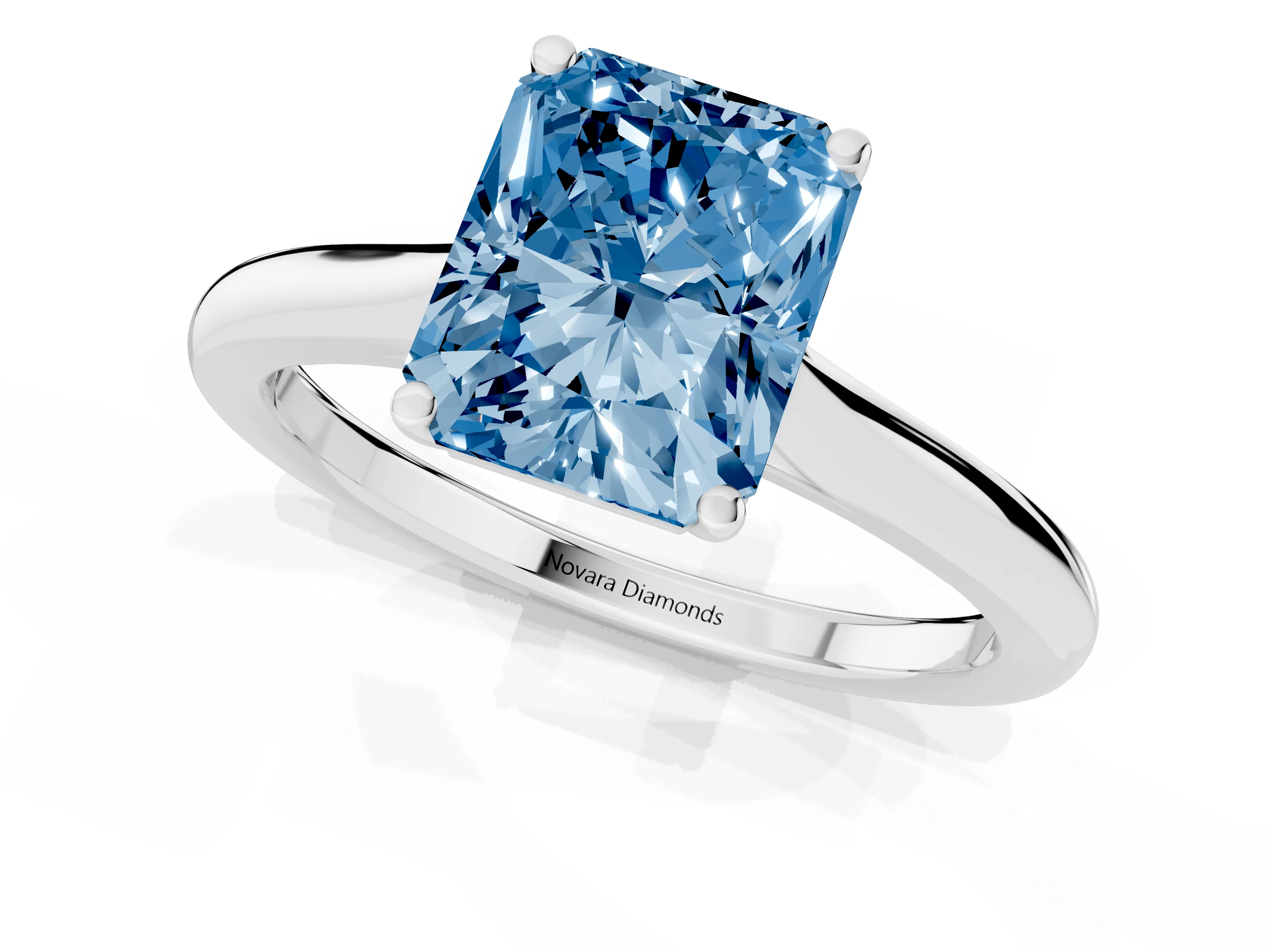 Fancy Blue Radiant Cut Diamond Solitaire Ring Set in Silver with Cathedral Band and Prong Setting