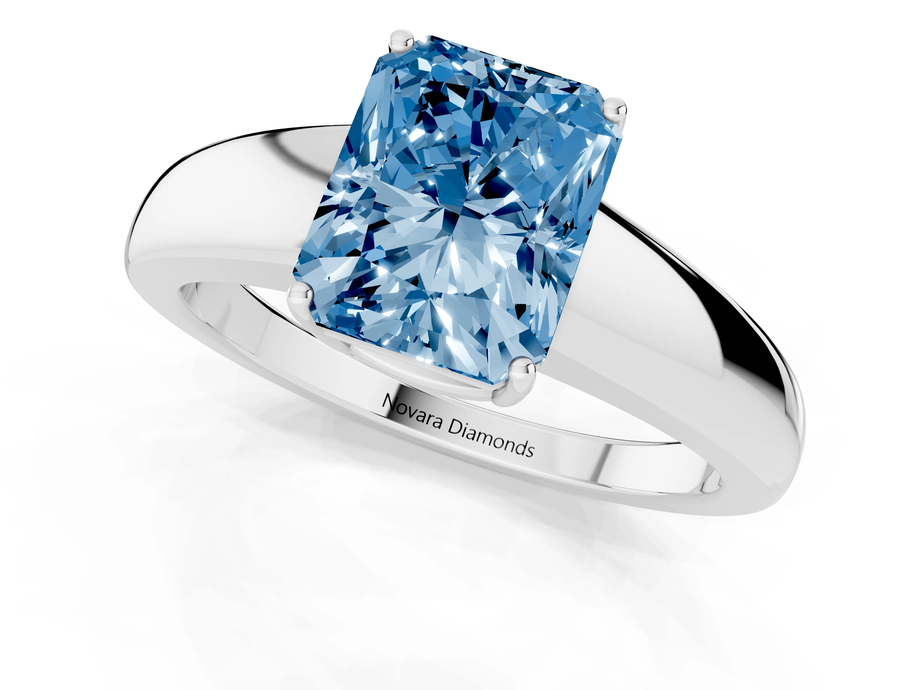 Fancy Blue Radiant Cut Diamond Solitaire Ring Set in White gold with Tapered Band and Prong Setting