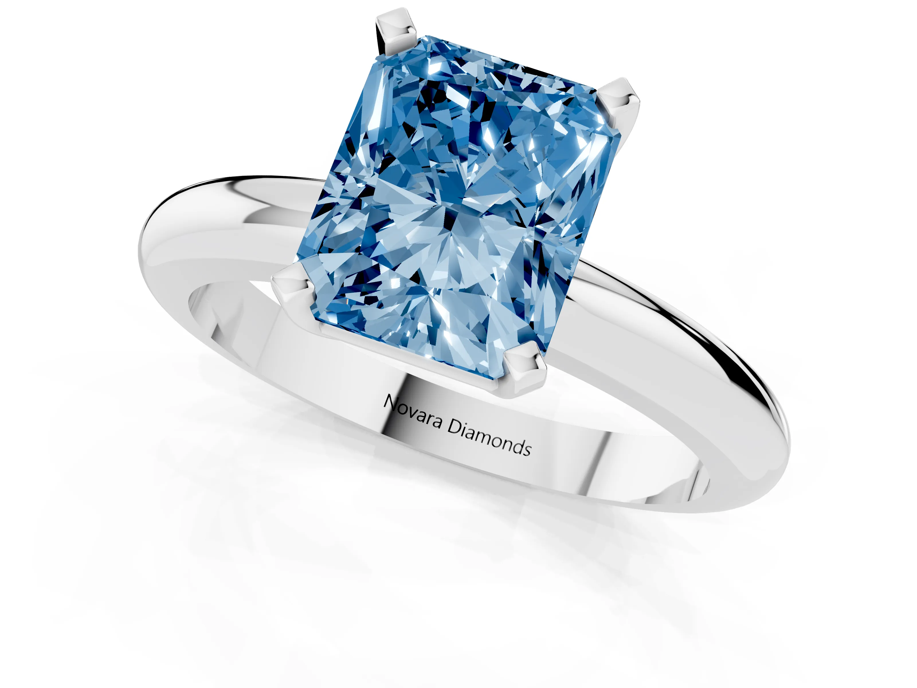 Fancy Blue Radiant Cut Diamond Solitaire Engagement Ring Set in Platinum with Round Band and Prong Setting