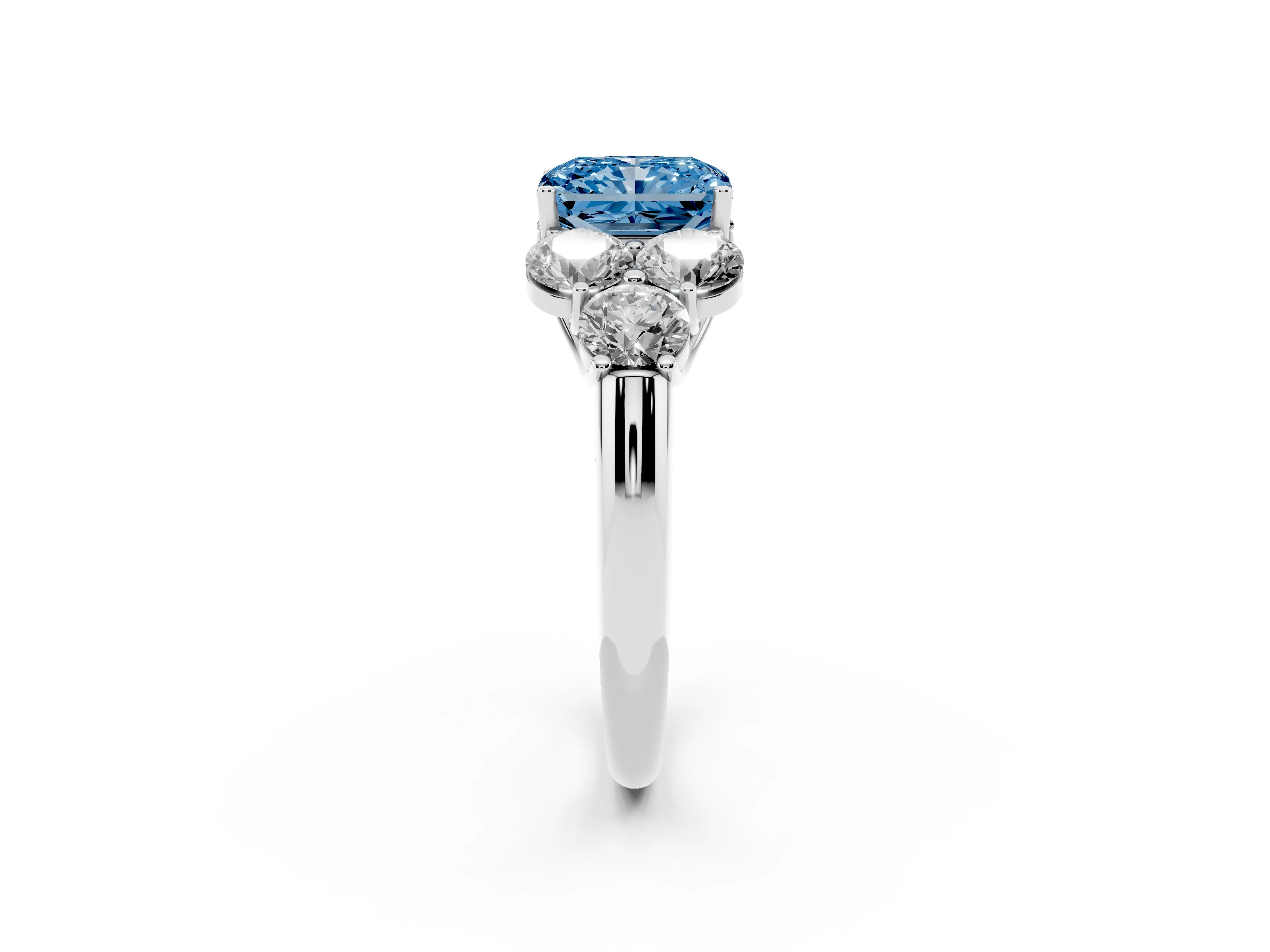 Fancy Blue Radiant Cut Diamond Cluster Ring Set in Silver with Round Accent Stones and Prong Setting on a Plain Band