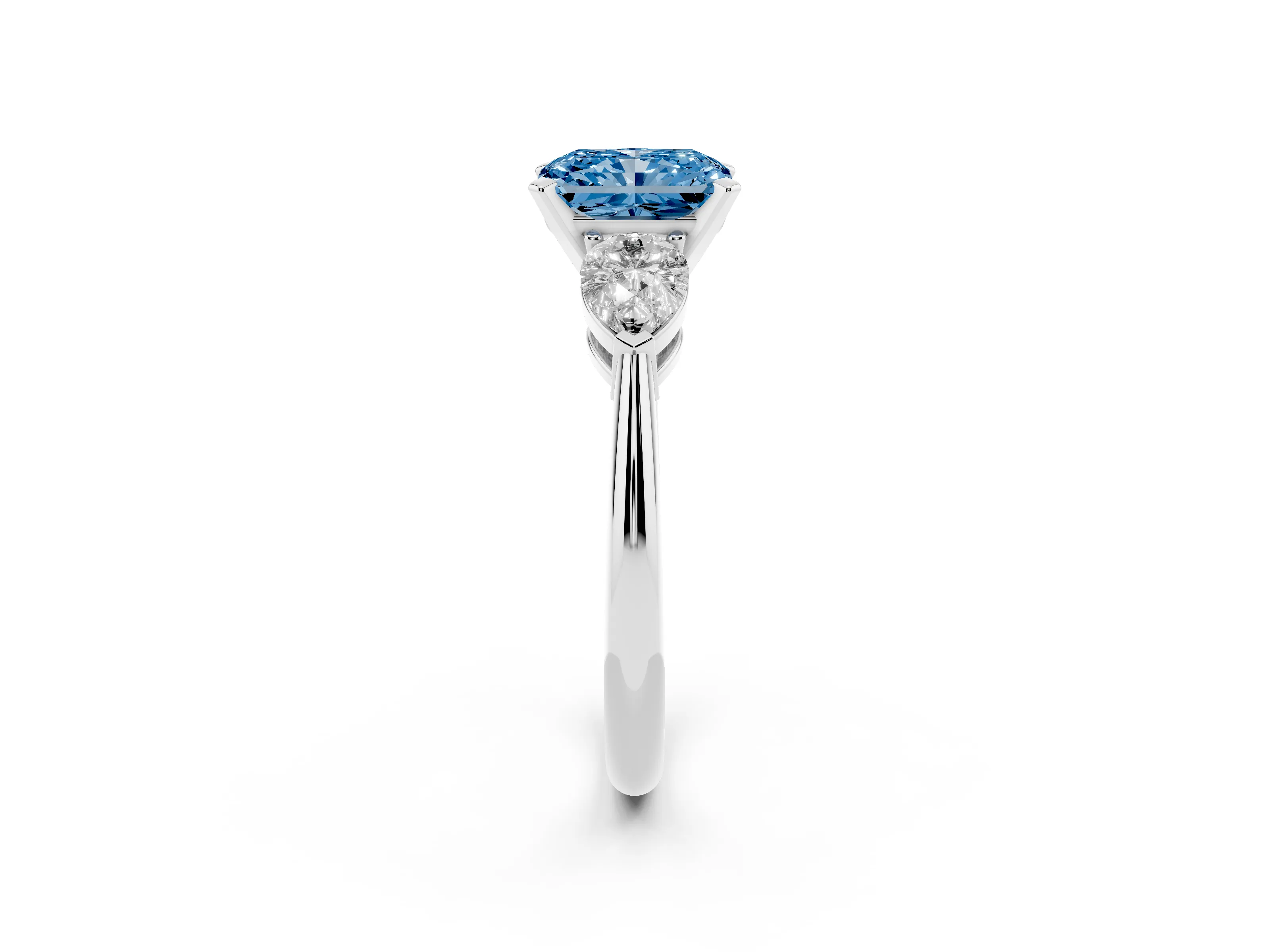 Fancy Blue Three-Stone Radiant Cut Diamond Ring Set in Platinum with Pear Side Stones and Prong Setting