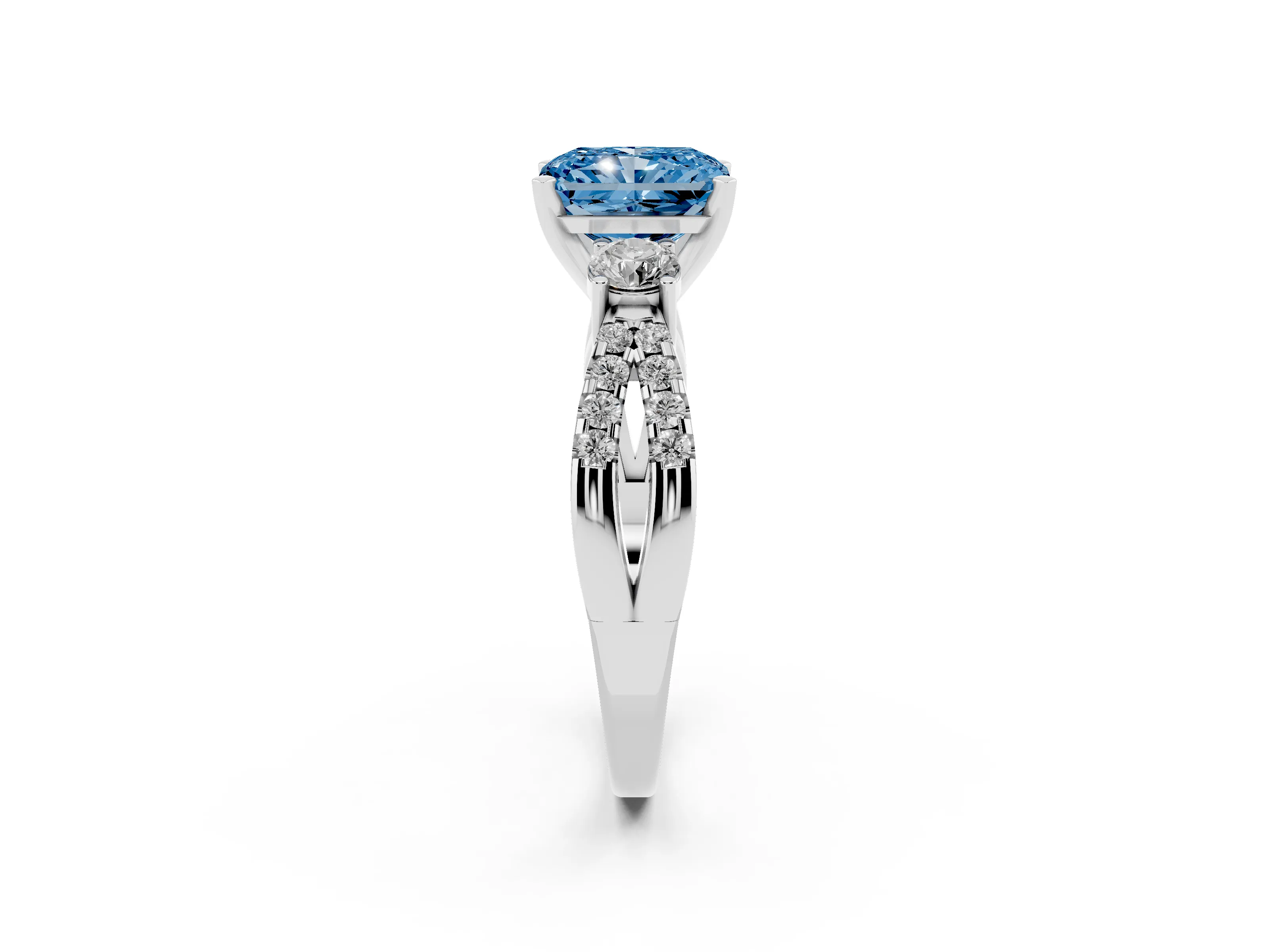 Fancy Blue Radiant Cut Diamond Three-Stone Ring Set in White gold with Pavé Split Shank and Prong Setting