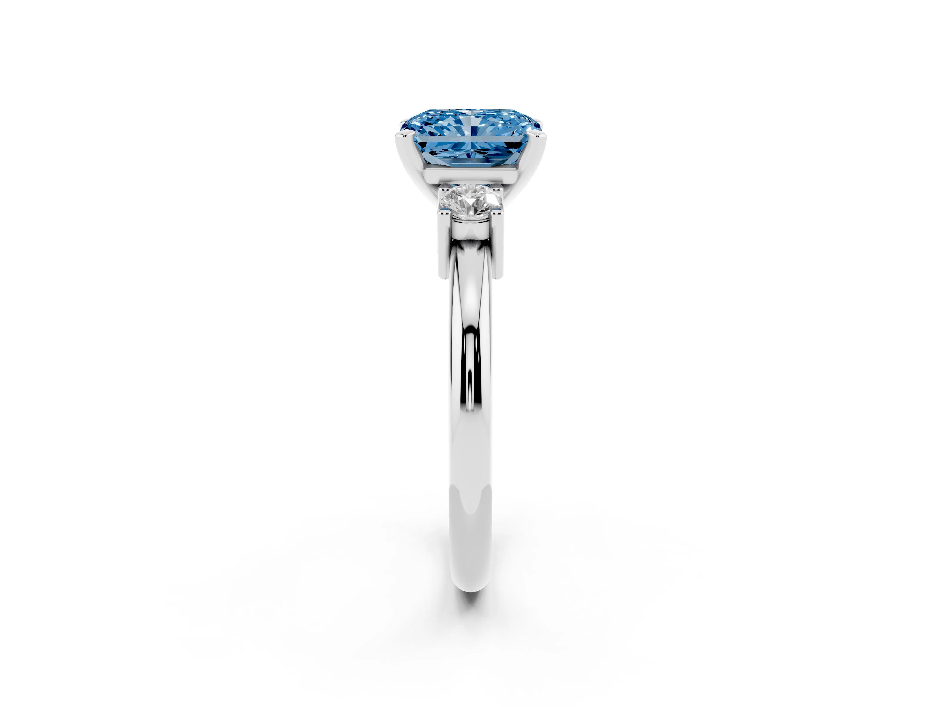 Fancy Blue Three-Stone Radiant Cut Diamond Ring Set in White gold with Prong Setting and Plain Band