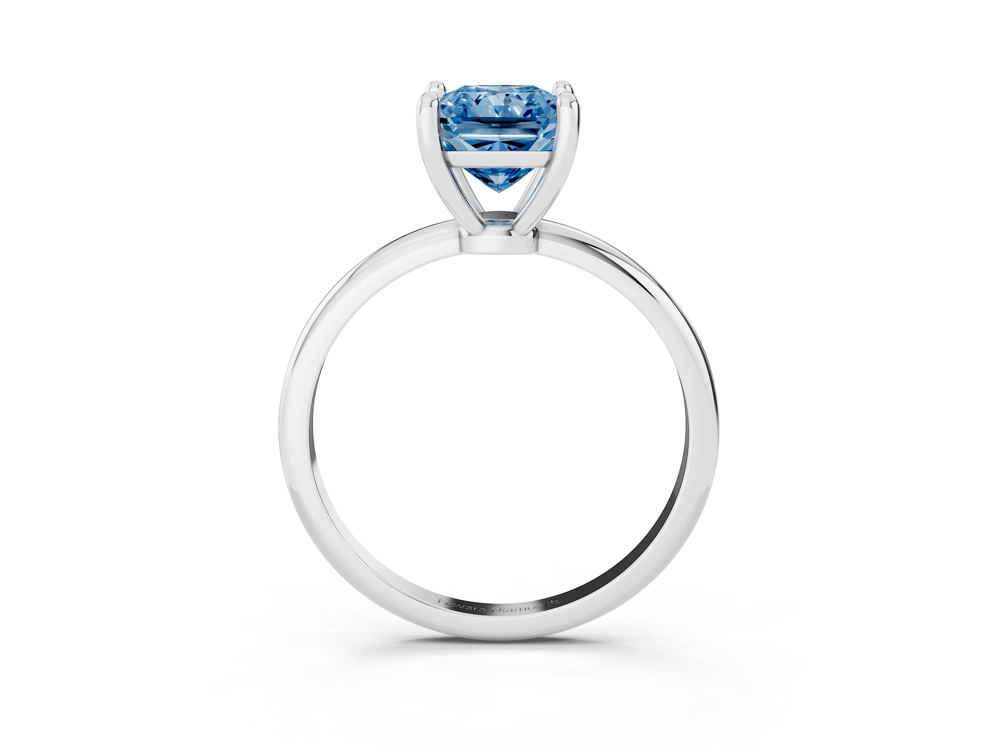 Fancy Blue Radiant Cut Diamond Solitaire Ring Set in White gold with Secure Prong Setting on a Classic Band