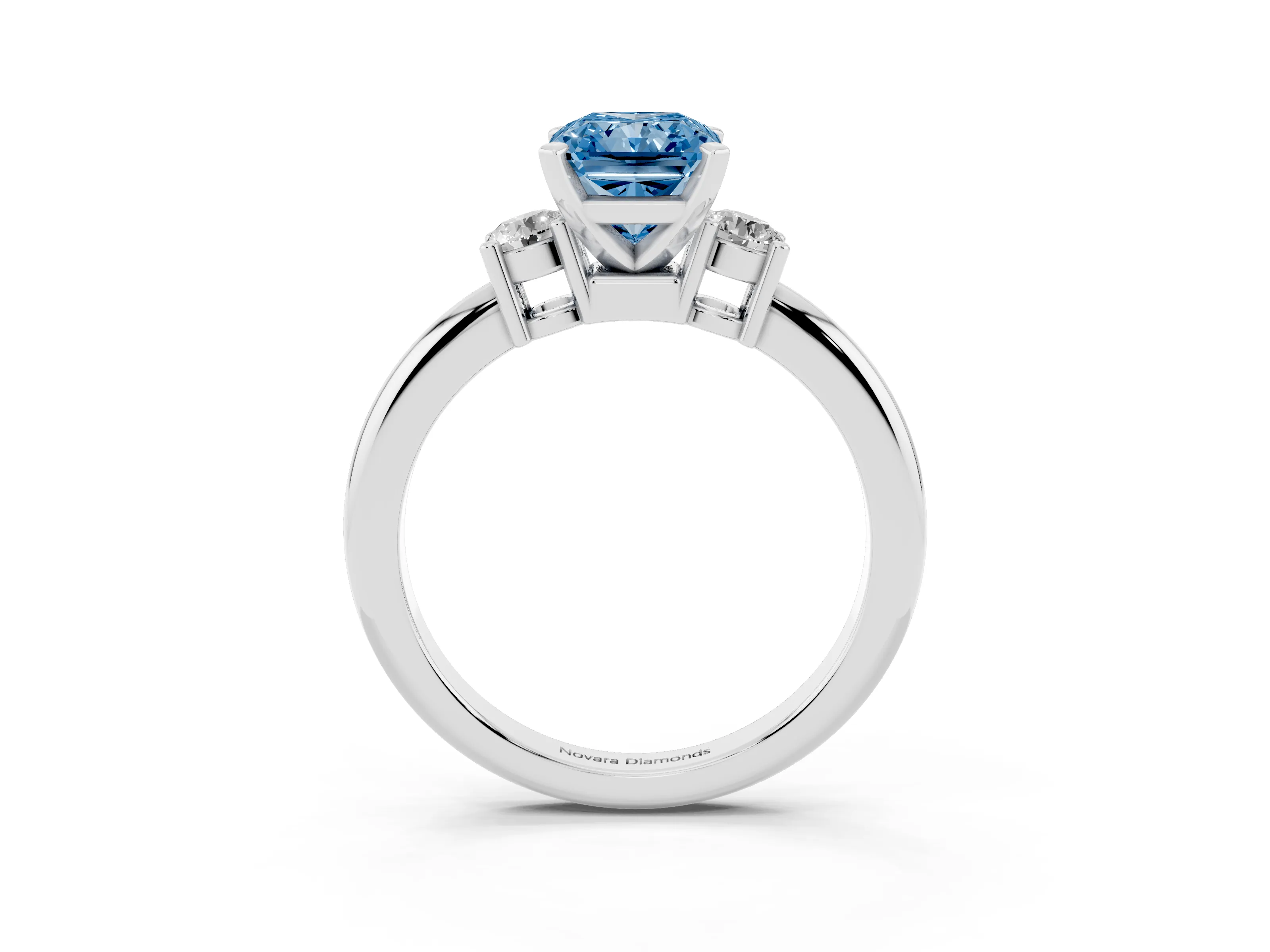 Fancy Blue Three-Stone Radiant Cut Diamond Ring Set in White gold with Prong Setting and Plain Band