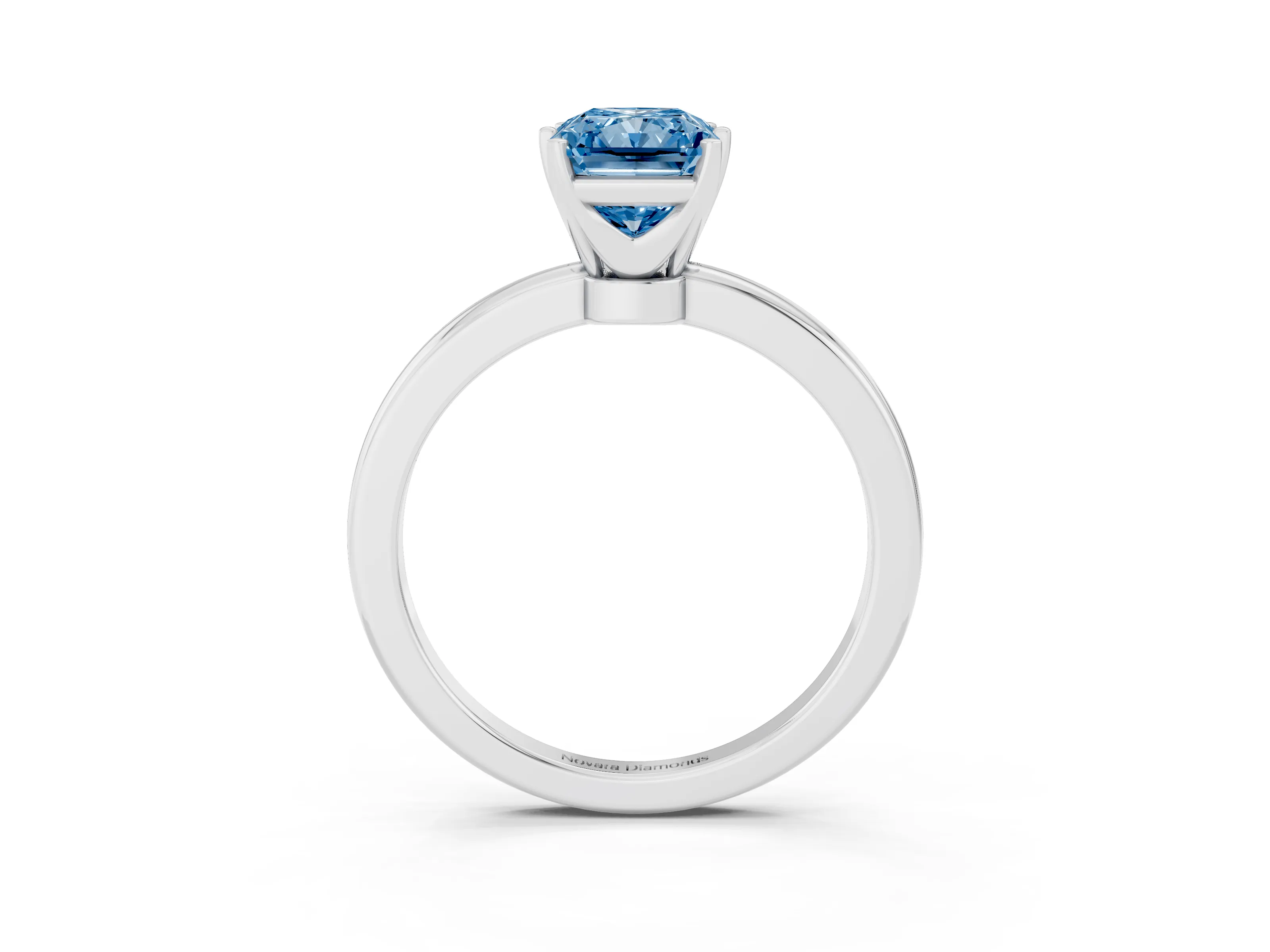 Fancy Blue Radiant Cut Diamond Solitaire Ring Set in Silver with Raised Prong Setting on a Classic Band