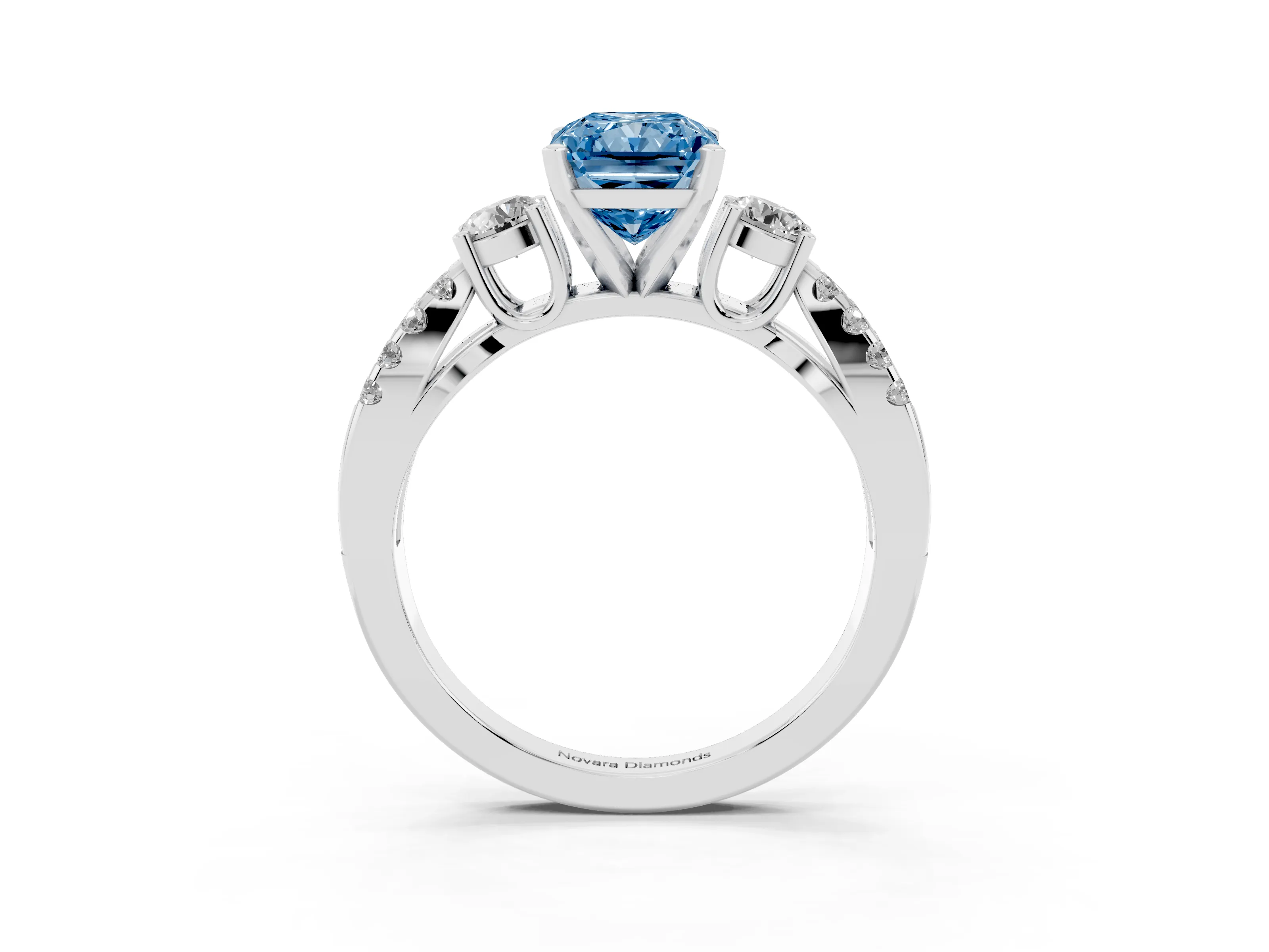 Fancy Blue Radiant Cut Diamond Three-Stone Ring Set in White gold with Pavé Split Shank and Prong Setting
