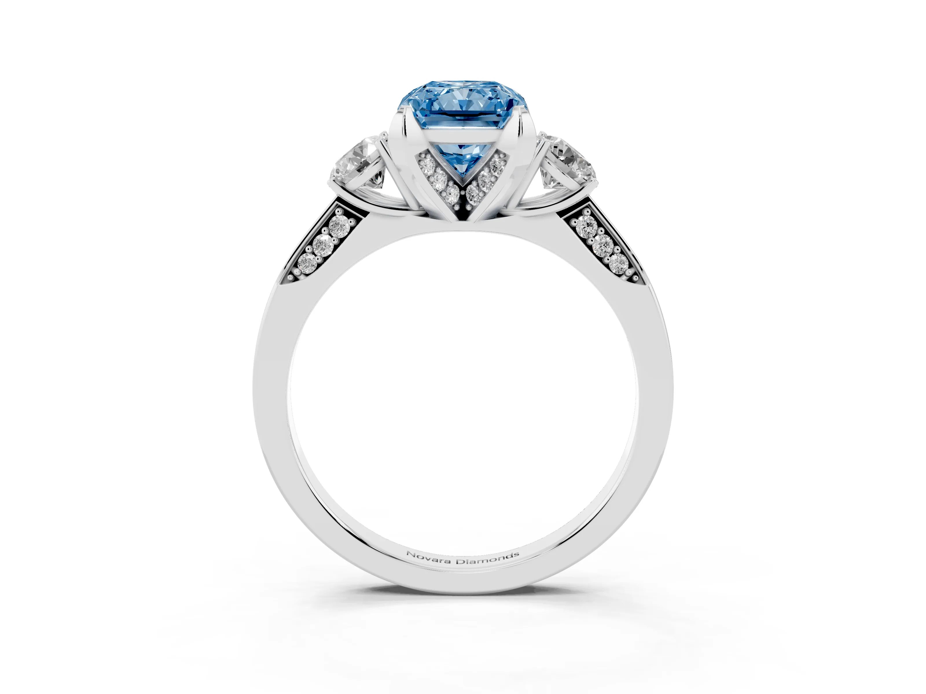 Fancy Blue Radiant Cut Diamond Three-Stone Ring Set in White gold with Pavé Band and Smaller Side Stones