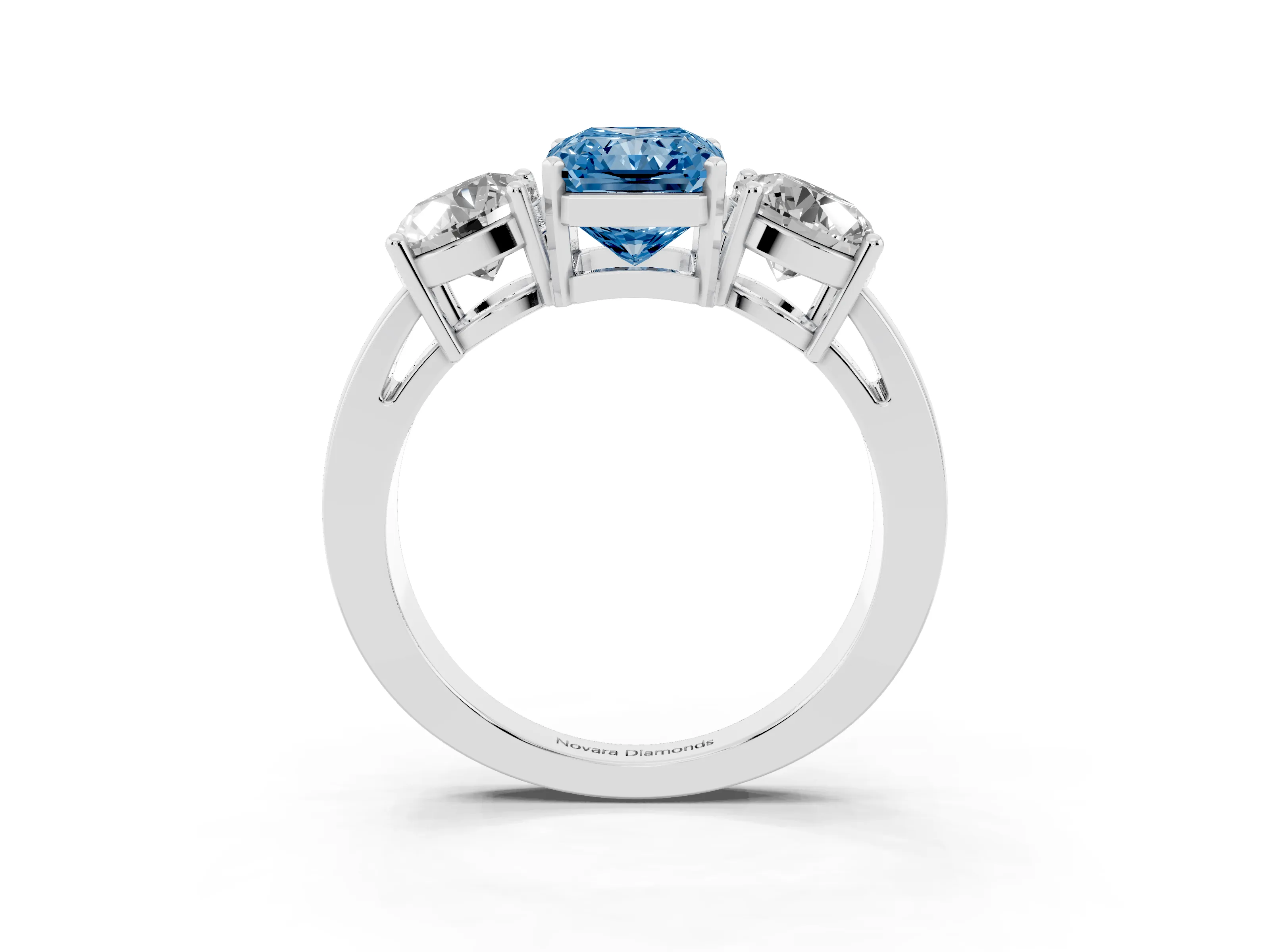 Fancy Blue Radiant Cut Diamond Three-Stone Ring Set in White gold with Round Side Stones and Classic Band