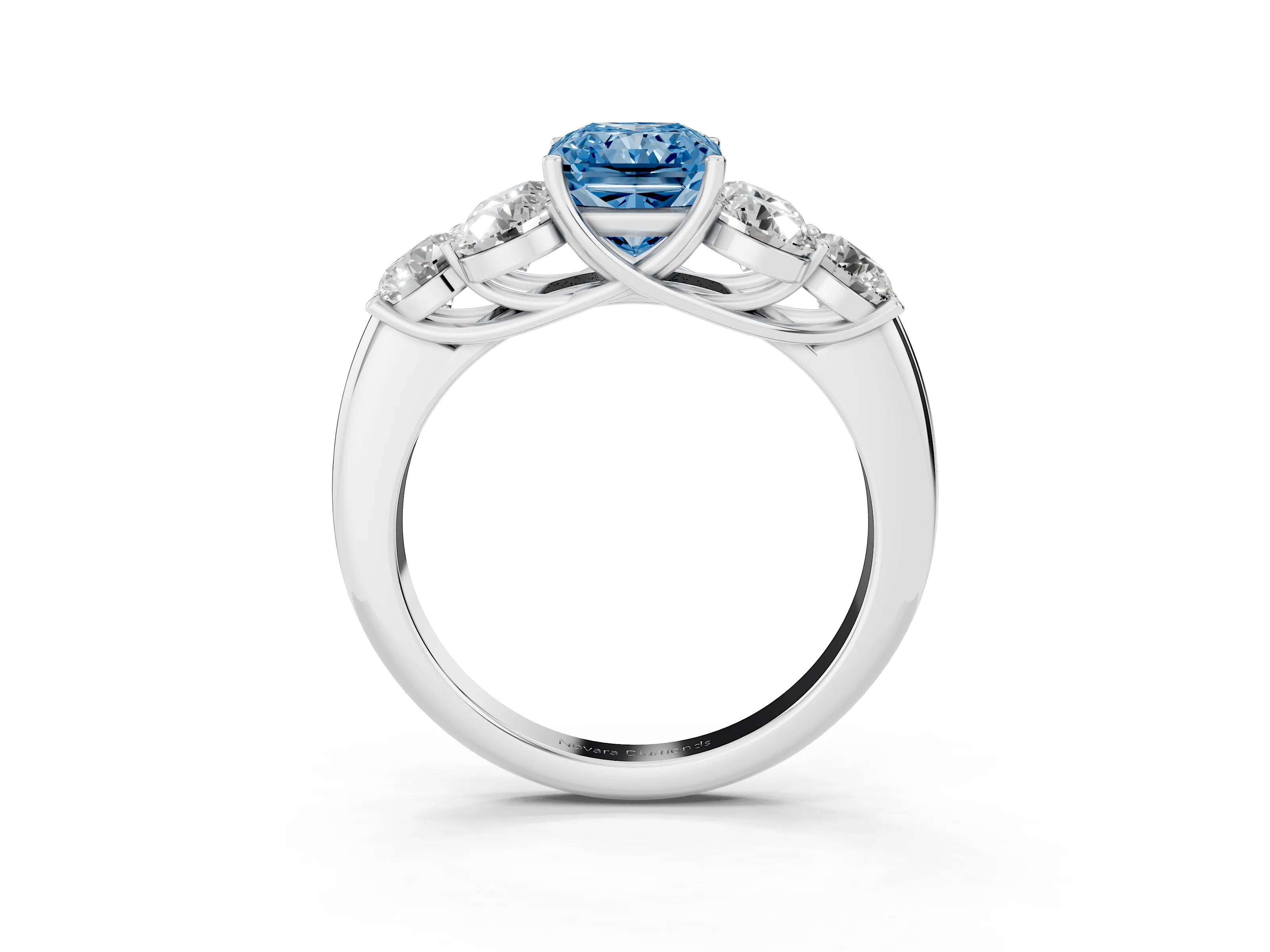 Fancy Blue Radiant Cut Diamond Cluster Ring Set in Silver with Round Accent Stones and Prong Setting on a Plain Band