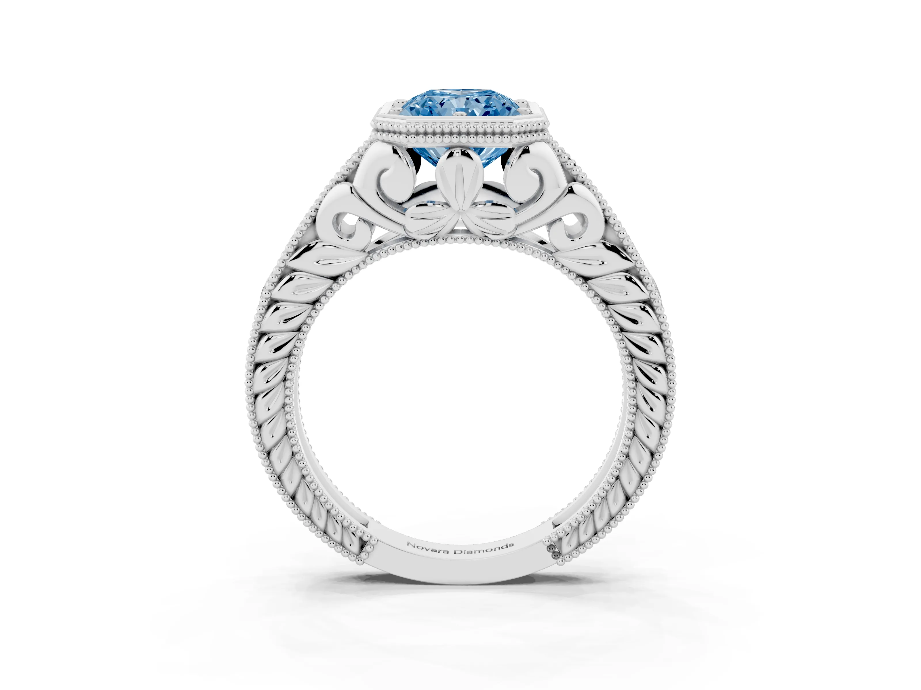 Fancy Blue Bezel Set Radiant Cut Diamond Milgrain Pavé Engagement Ring Set in Platinum