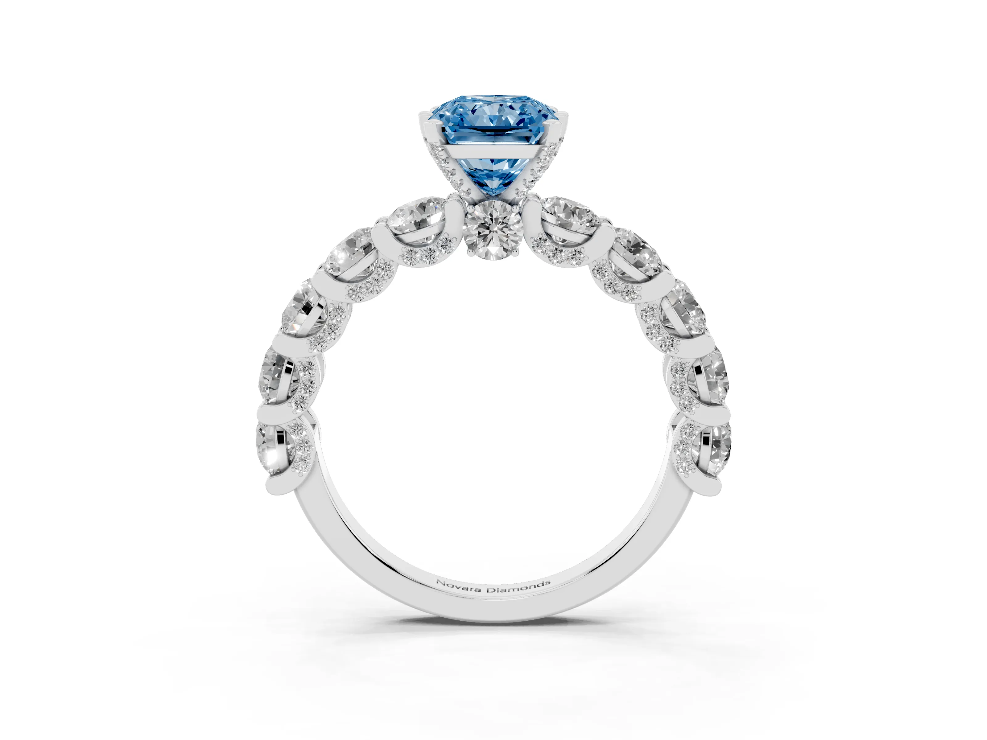 Fancy Blue Radiant Cut Diamond Side Stone Ring Set in Platinum with Alternating Round and Oval Side Stones