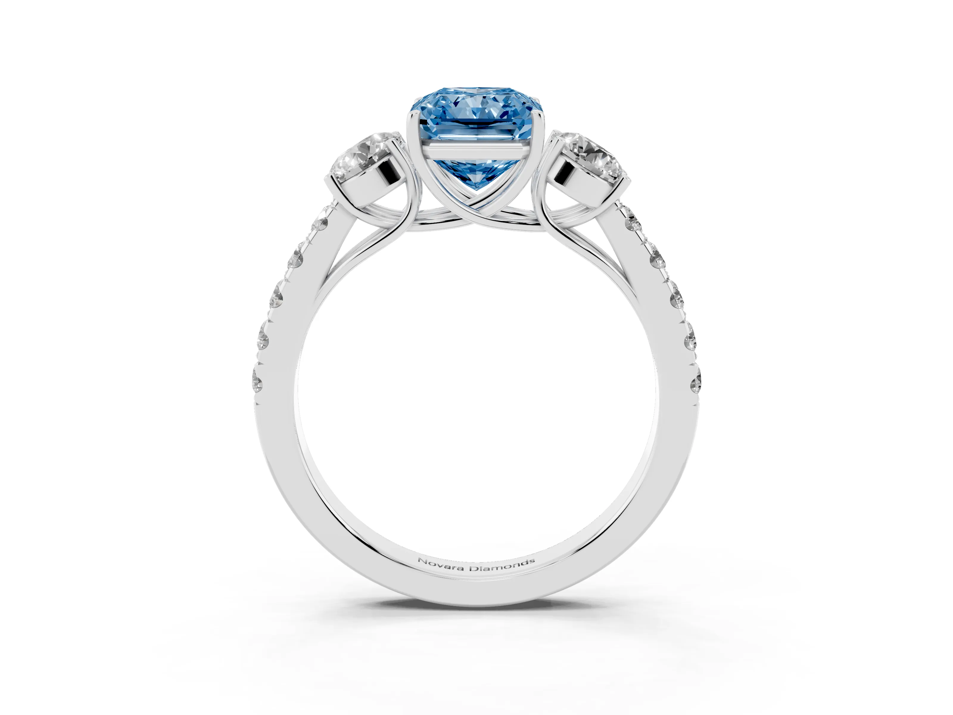Fancy Blue Radiant Cut Diamond Three-Stone Ring Set in Silver with Round Side Stones and Delicate Pavé Band